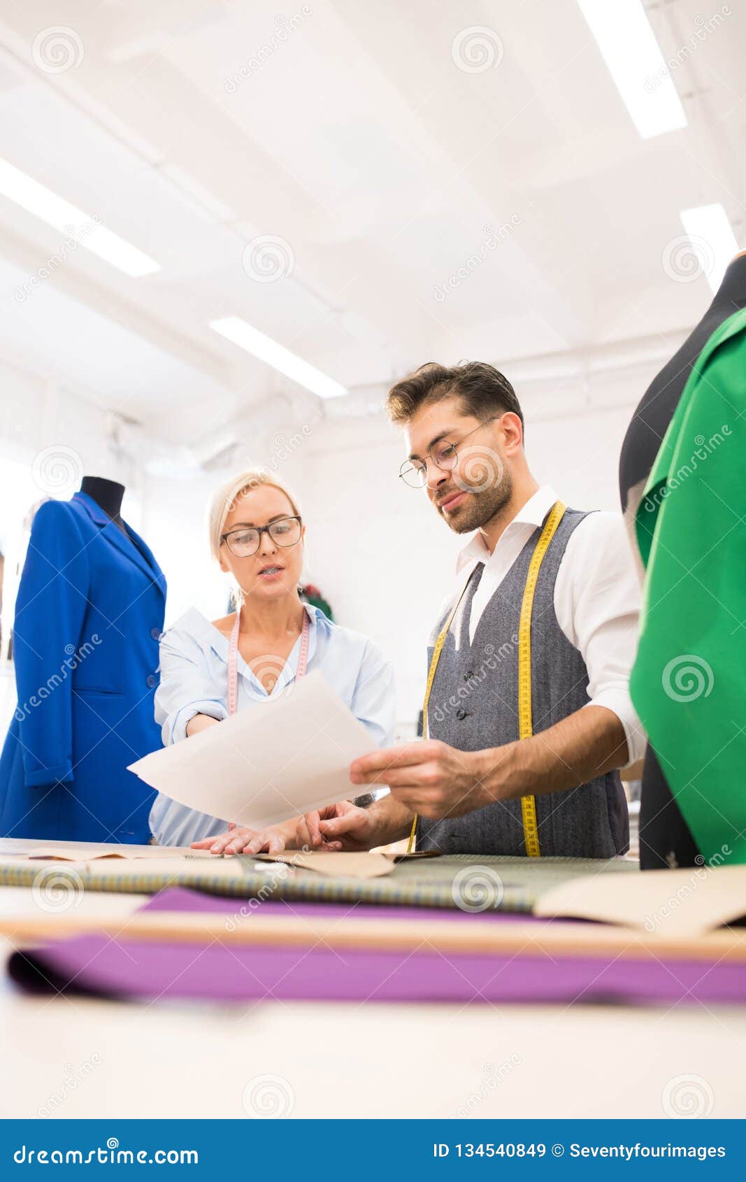 Two Designers in Atelier stock image. Image of fashiondesigner - 134540849