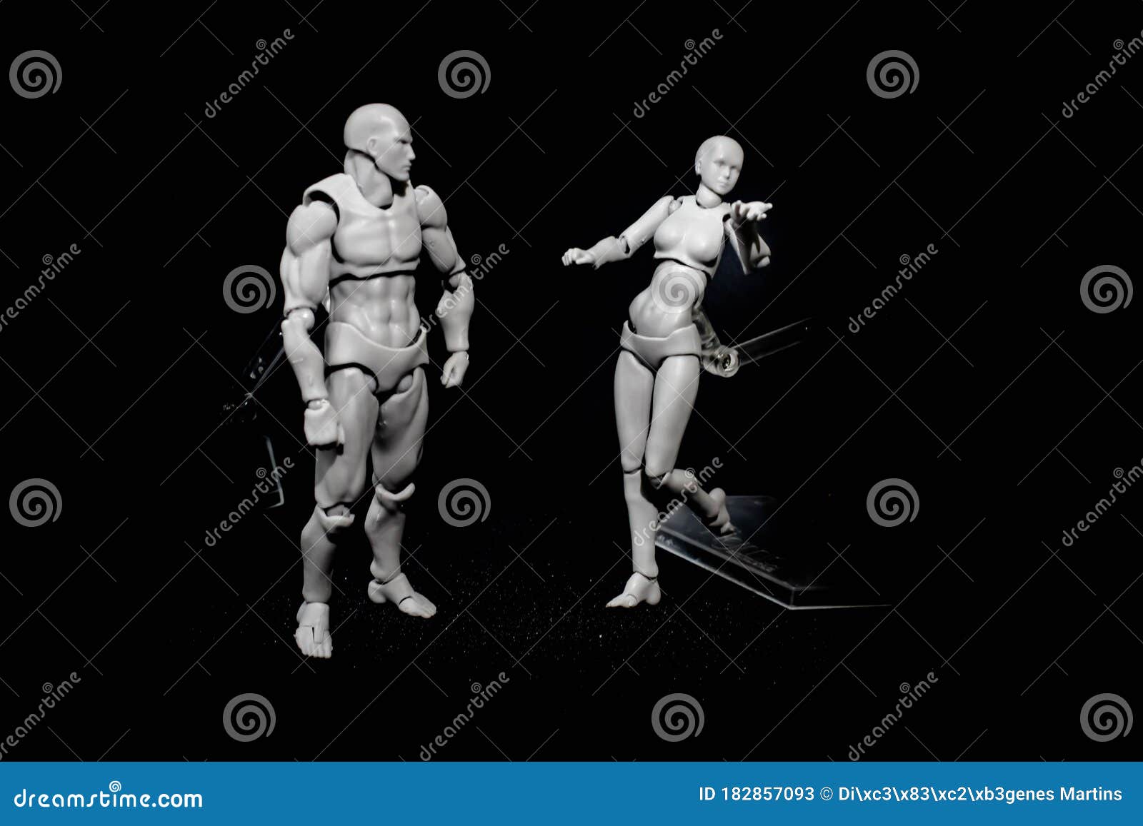 two-dolls-acting-posing-black-background-two-articulated-dolls-models-acting-posing-black-background-pose-chatting-serious-182857093.jpg