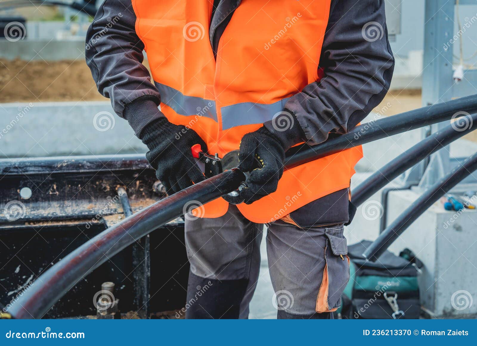 Two Electrician Builder Workers Installing Highvoltage Cable Stock