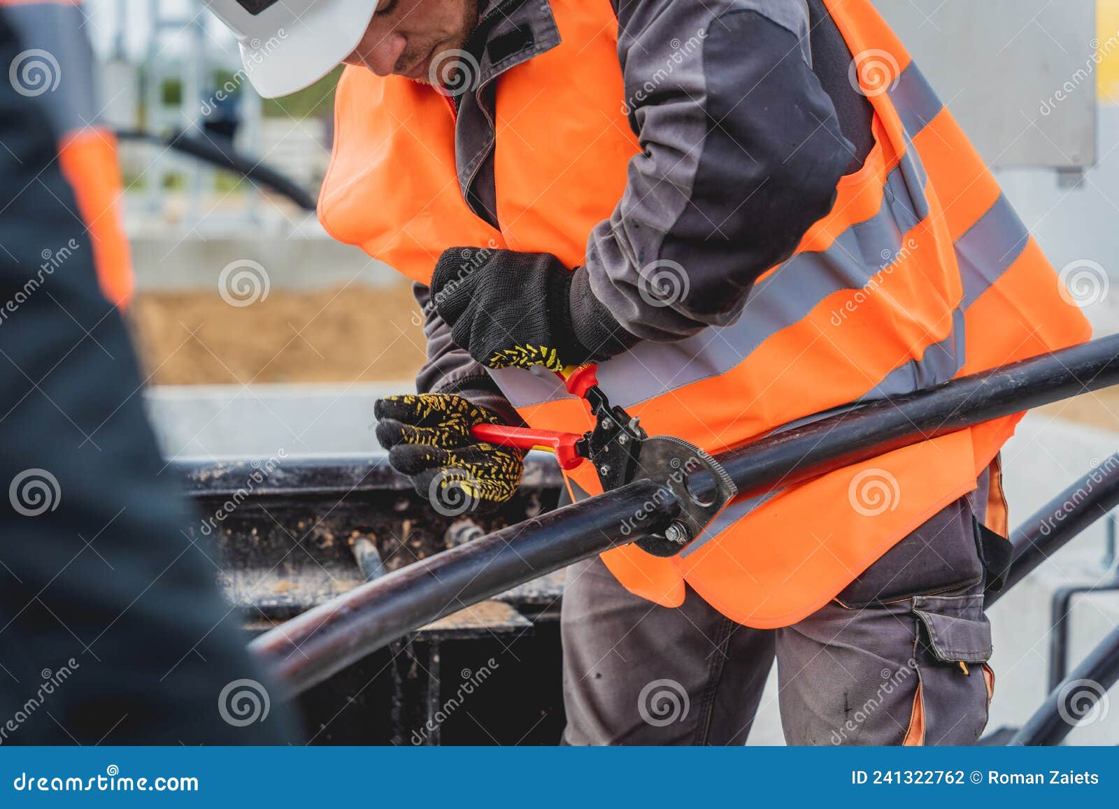 Two Electrician Builder Workers Installing Highvoltage Cable Stock