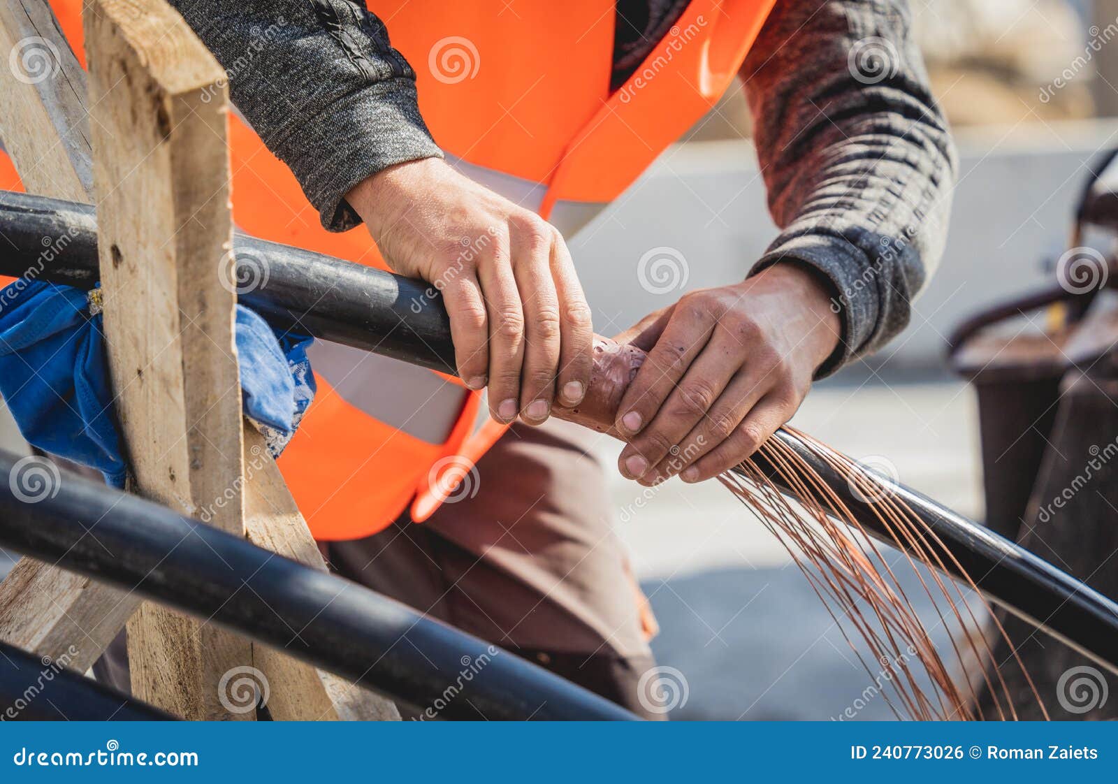 Two Electrician Builder Workers Installing Highvoltage Cable Stock