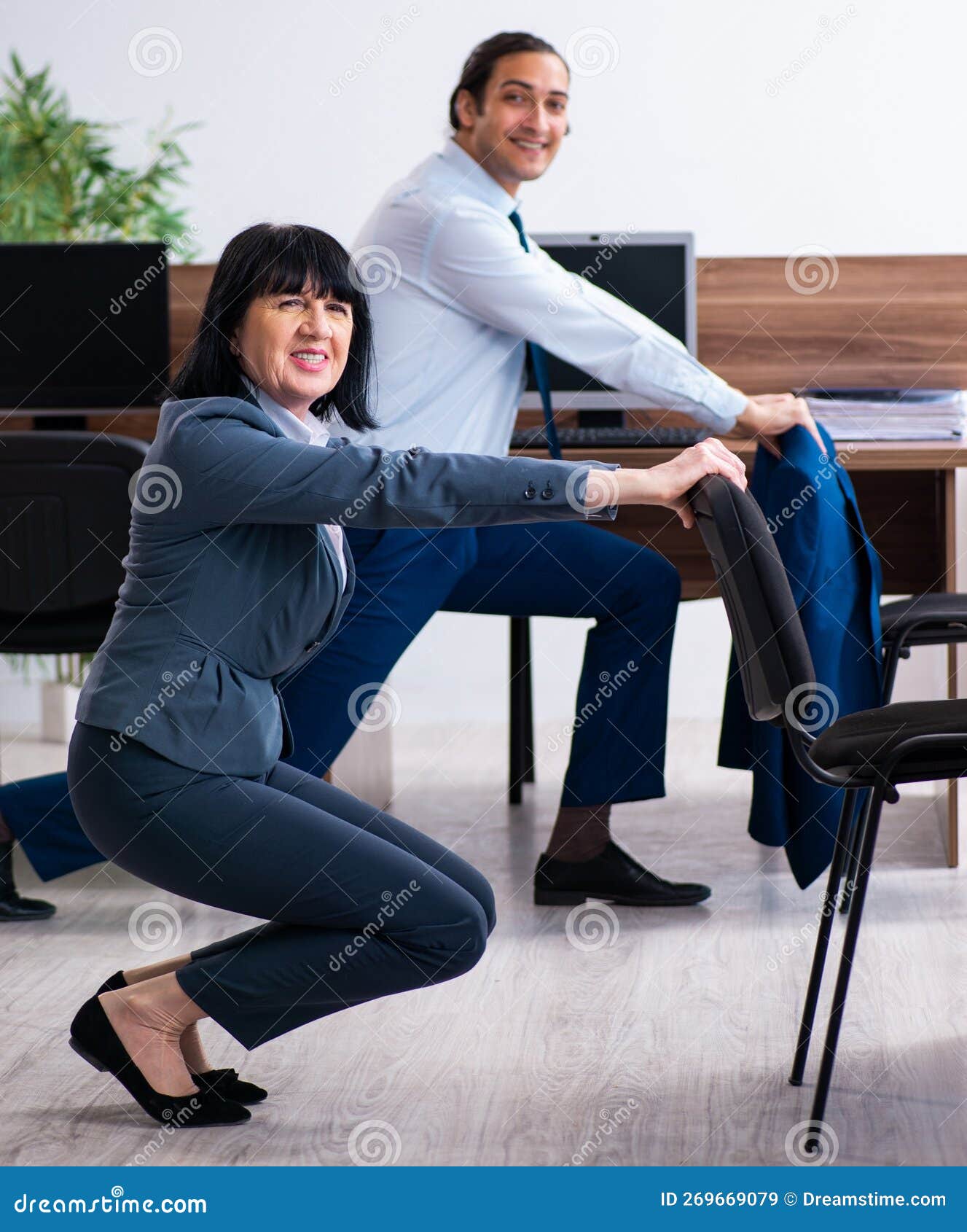 Two Employees Doing Sport Exercises in the Office Stock Image Image