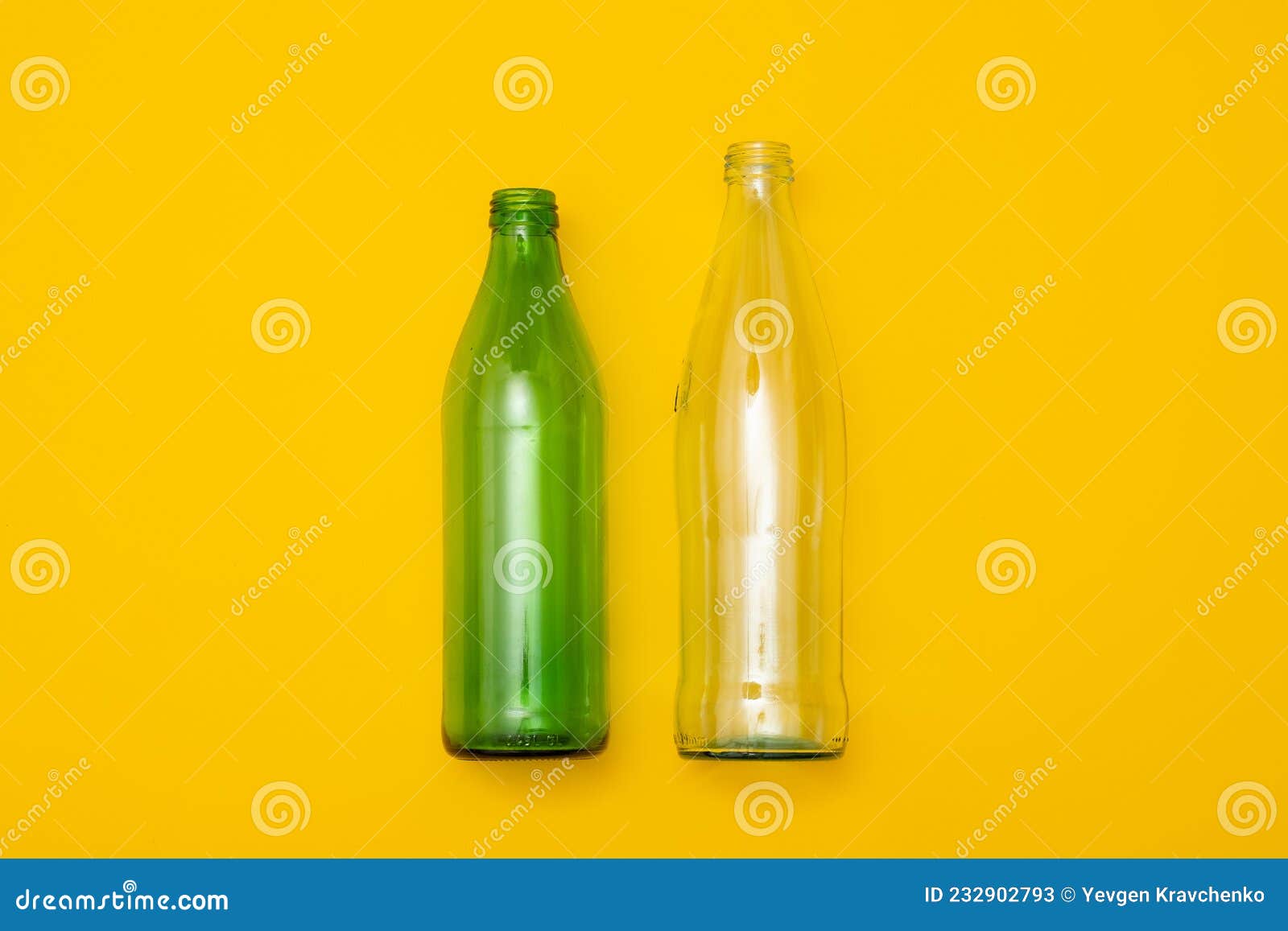two empty glass bottle on a yellow background. eco-friendly packaging, waste recycling concept, glass waste, rubish sort