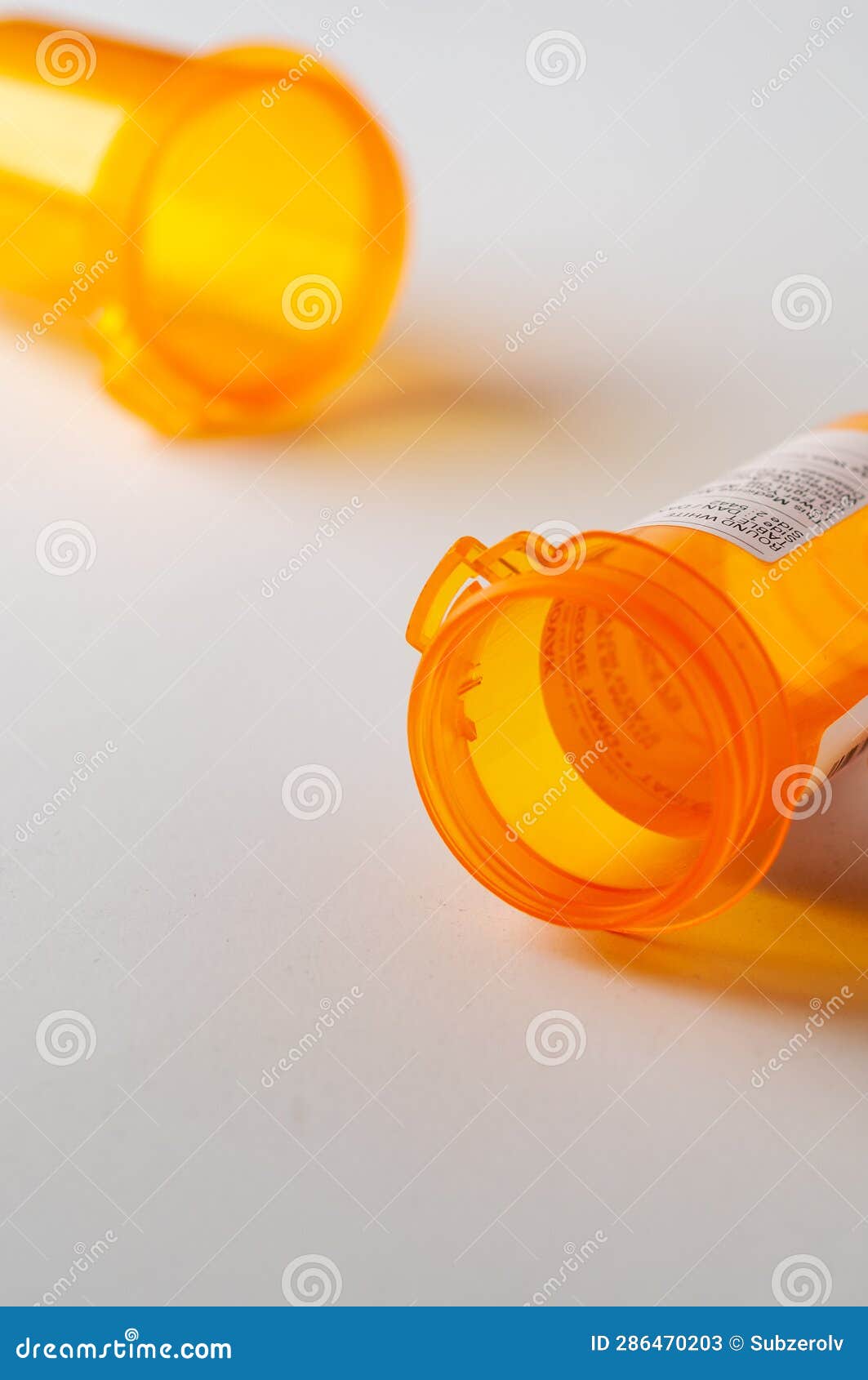 Two Empty Pill Bottles with Partial Label Showing Stock Image Image