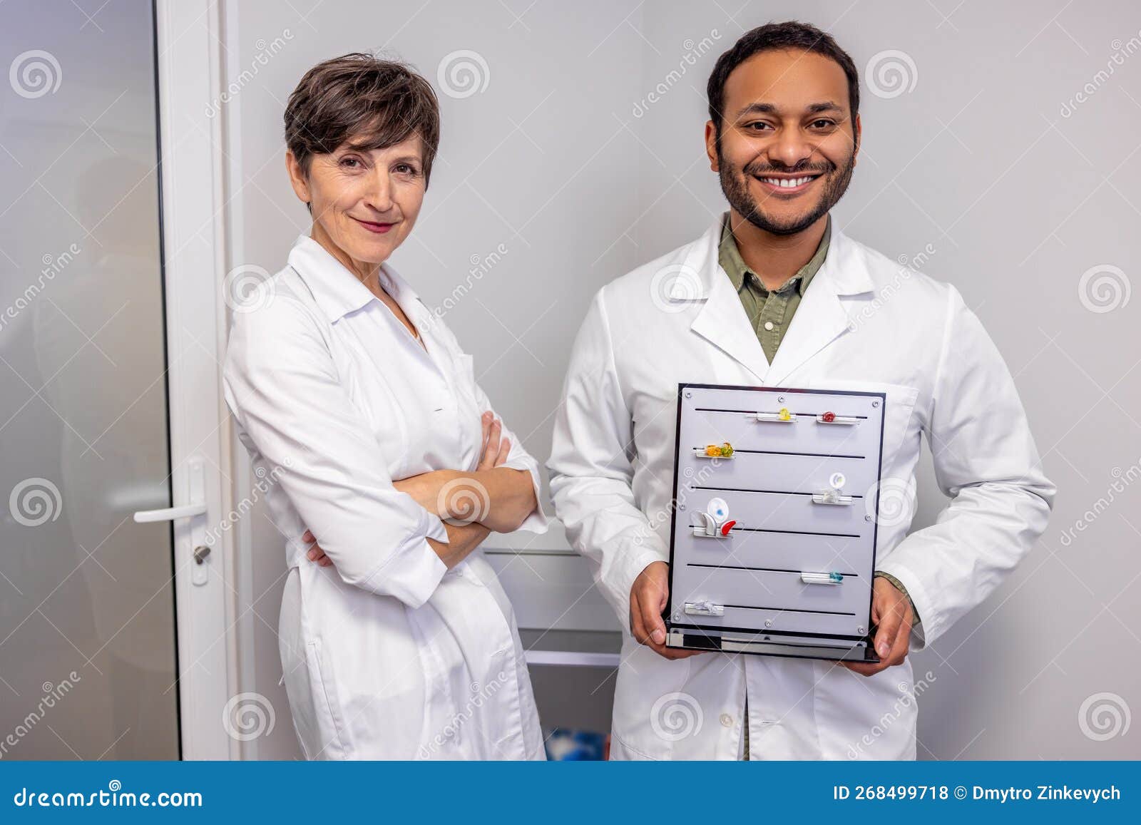 Two Ent Doctors Demonstrating Innovative Hearing Aids Stock Photo ...