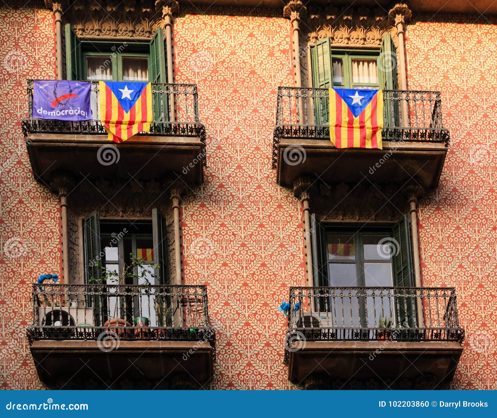 two estelada flags and democracia banner