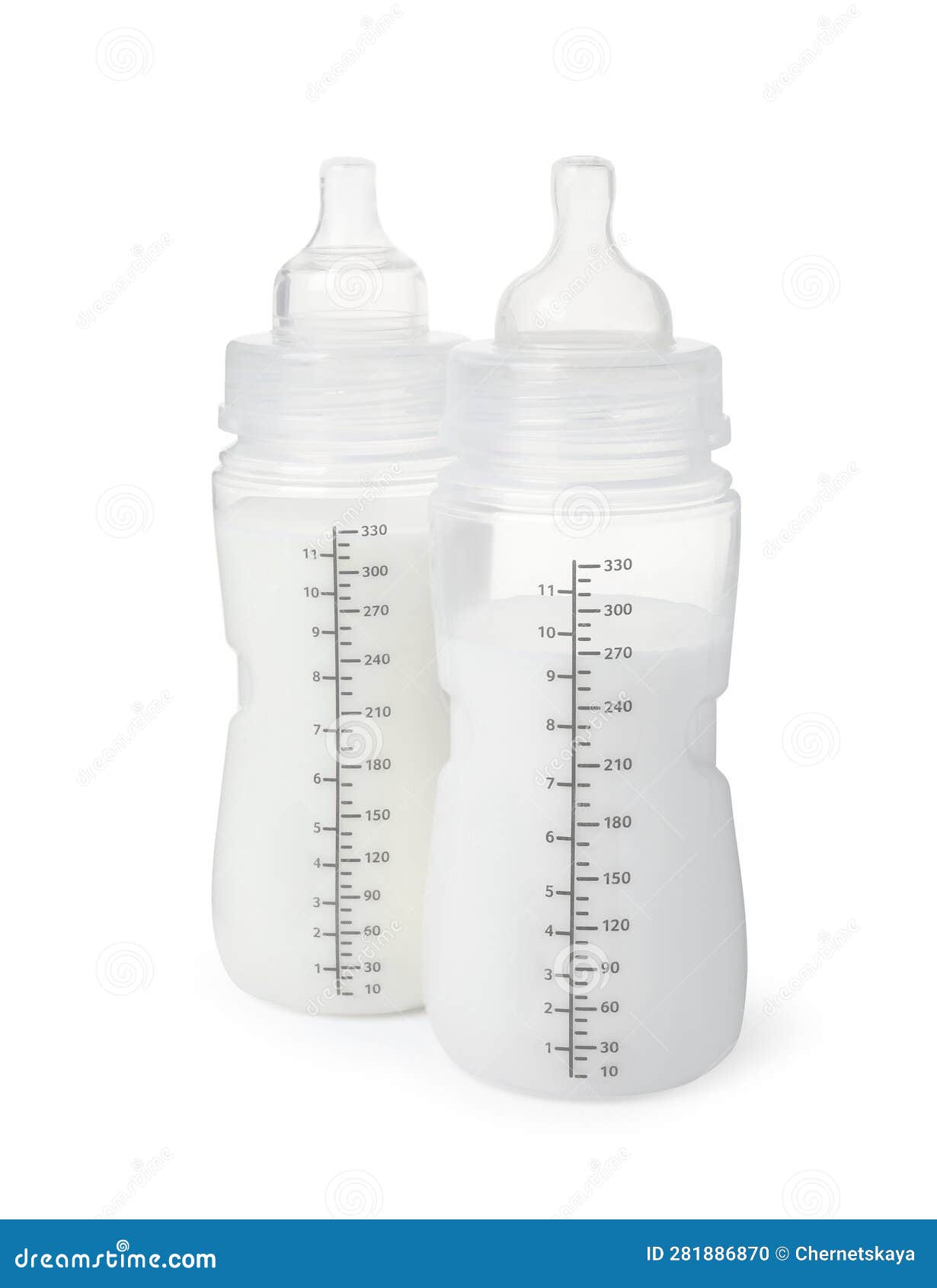 Two Feeding Bottles with Infant Formula on White Background Stock Photo