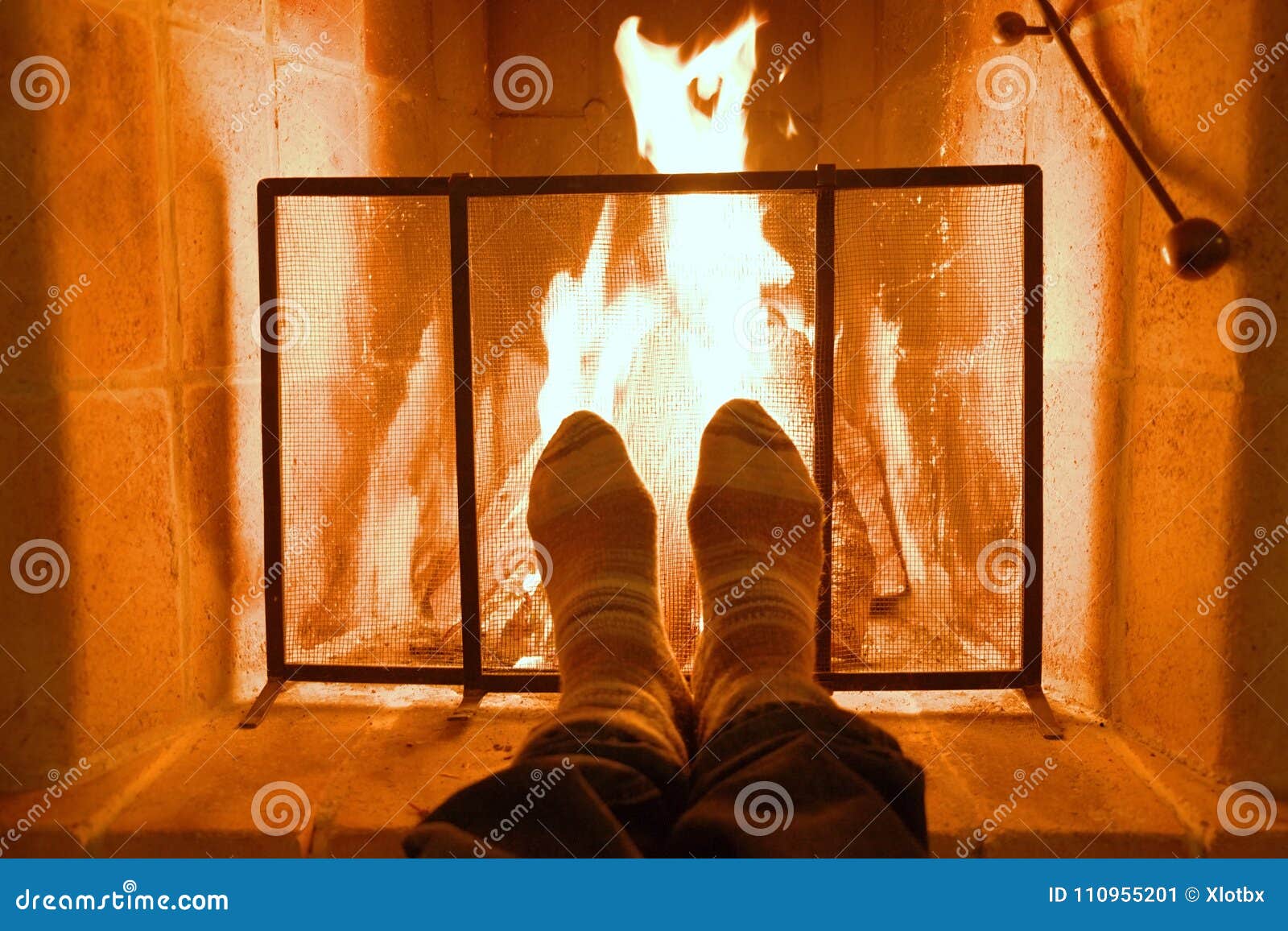 feet warming up on fireplace - a Royalty Free Stock Photo from Photocase