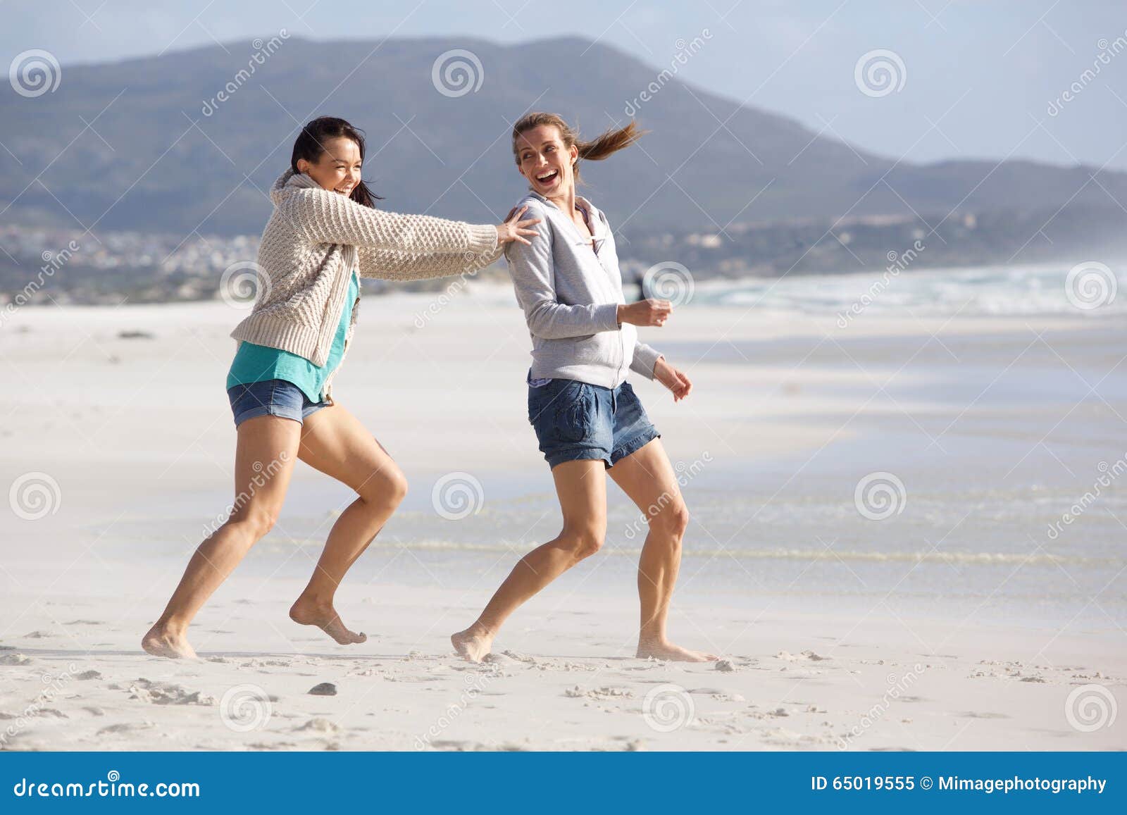 Two Female Friends Playing on the Beach Stock Image - Image of paradise ...