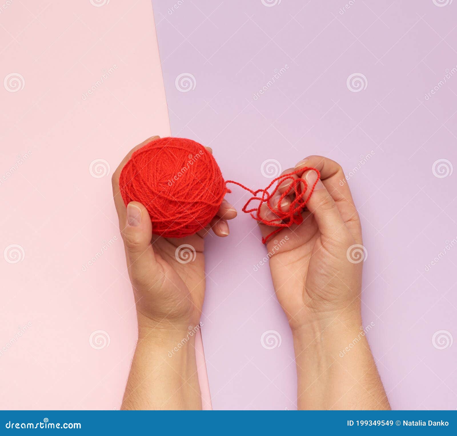 Skein of green and brown thread on a beige background Stock Photo by ndanko