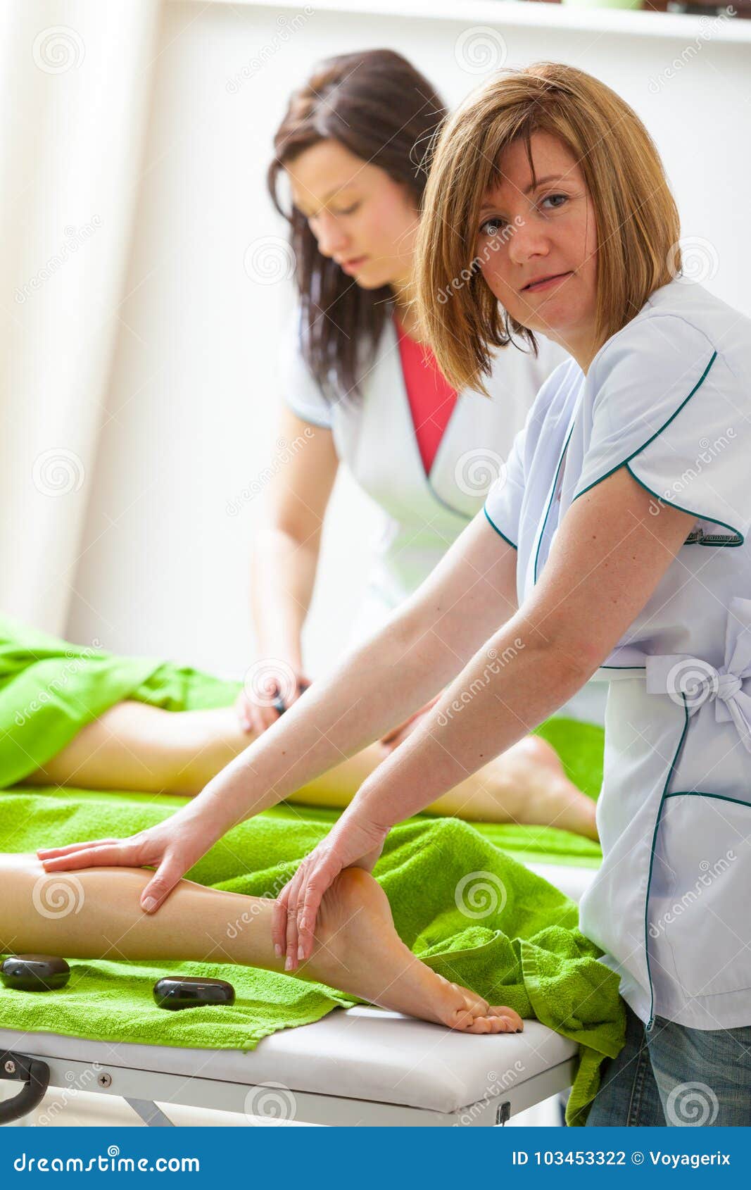Two Female Masseuse Doing Legs Massage Stock Photo Image Of Hygiene Comfort