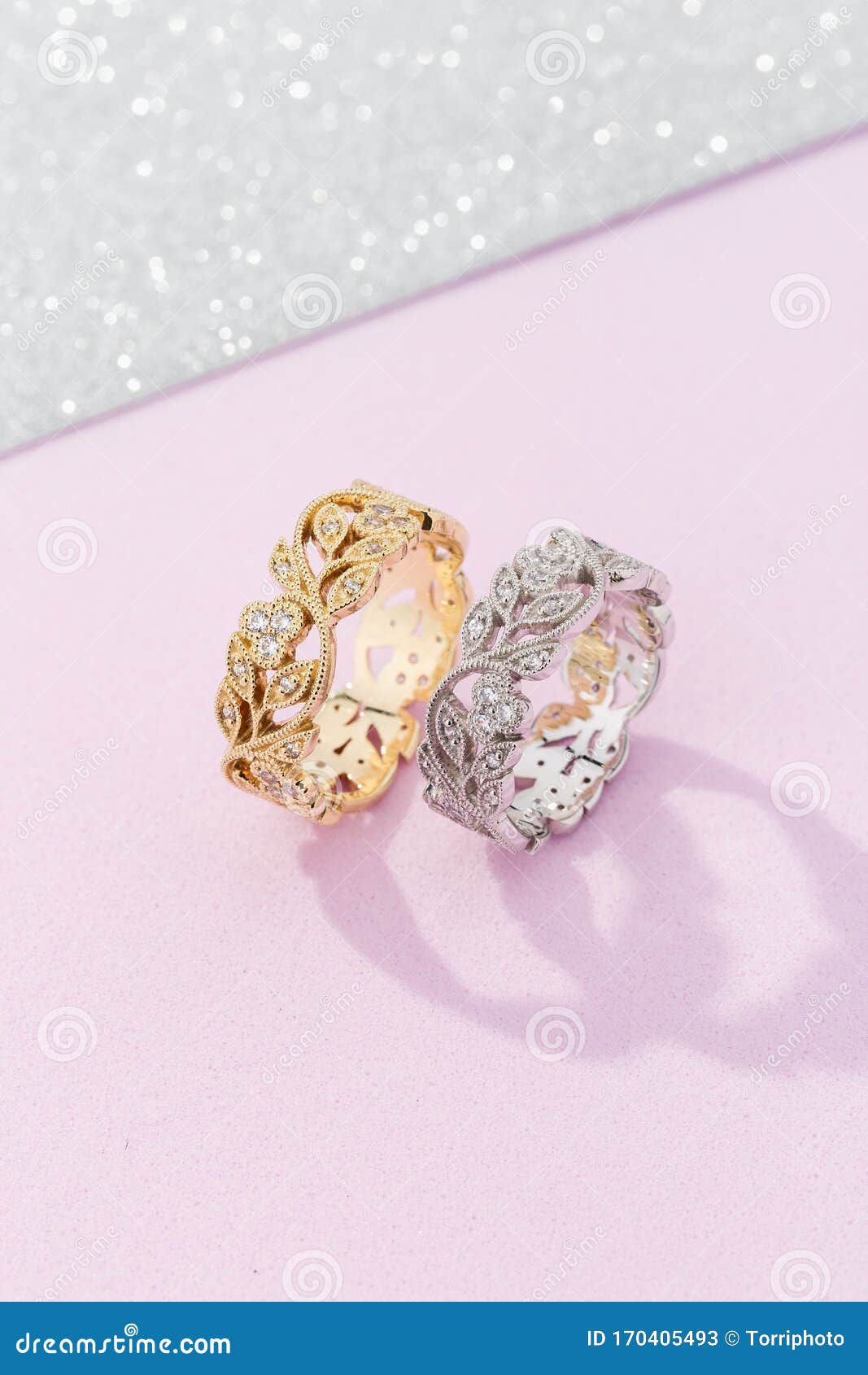 Two Female Wedding Rings with Floral Design on Pink Background ...