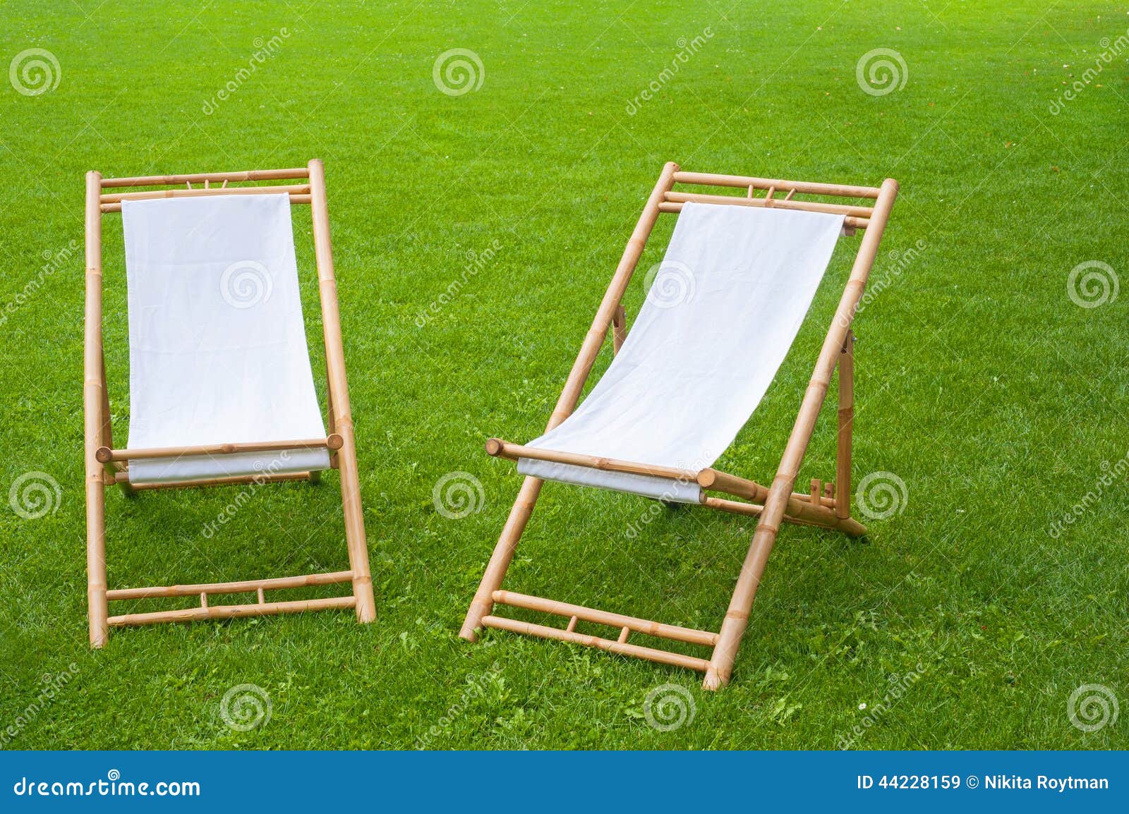 Two Folding Chairs in a Green Park Stock Image Image of deckchairs, spring 44228159
