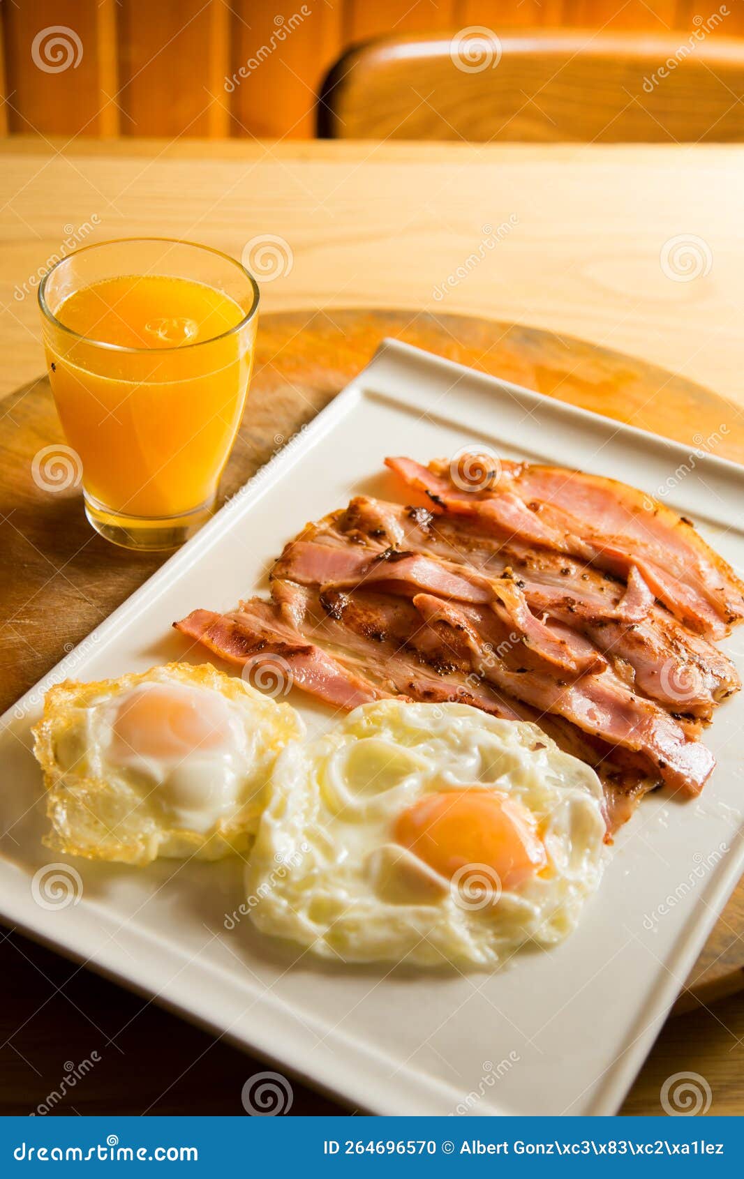 Two Fried Eggs with Bacon and Orange Juice. Stock Photo Image of