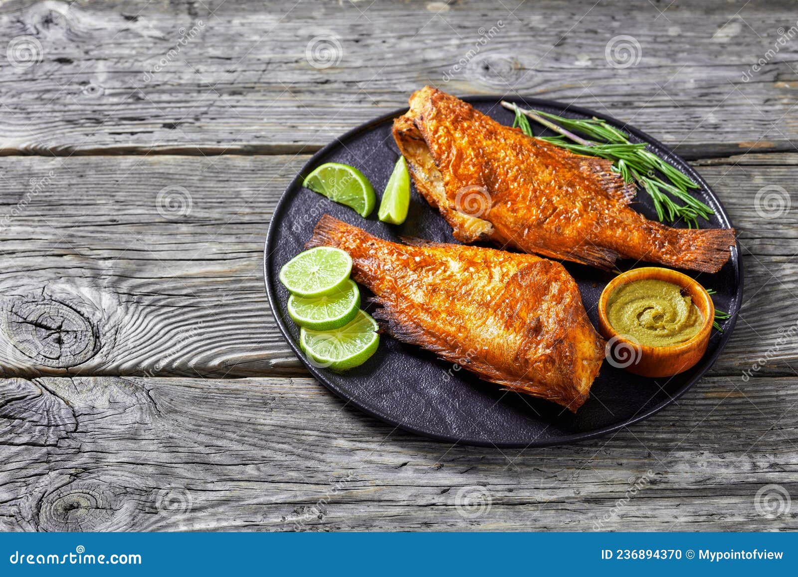 Two Fried Ocean Perch with Rosemary and Lime Stock Photo Image of