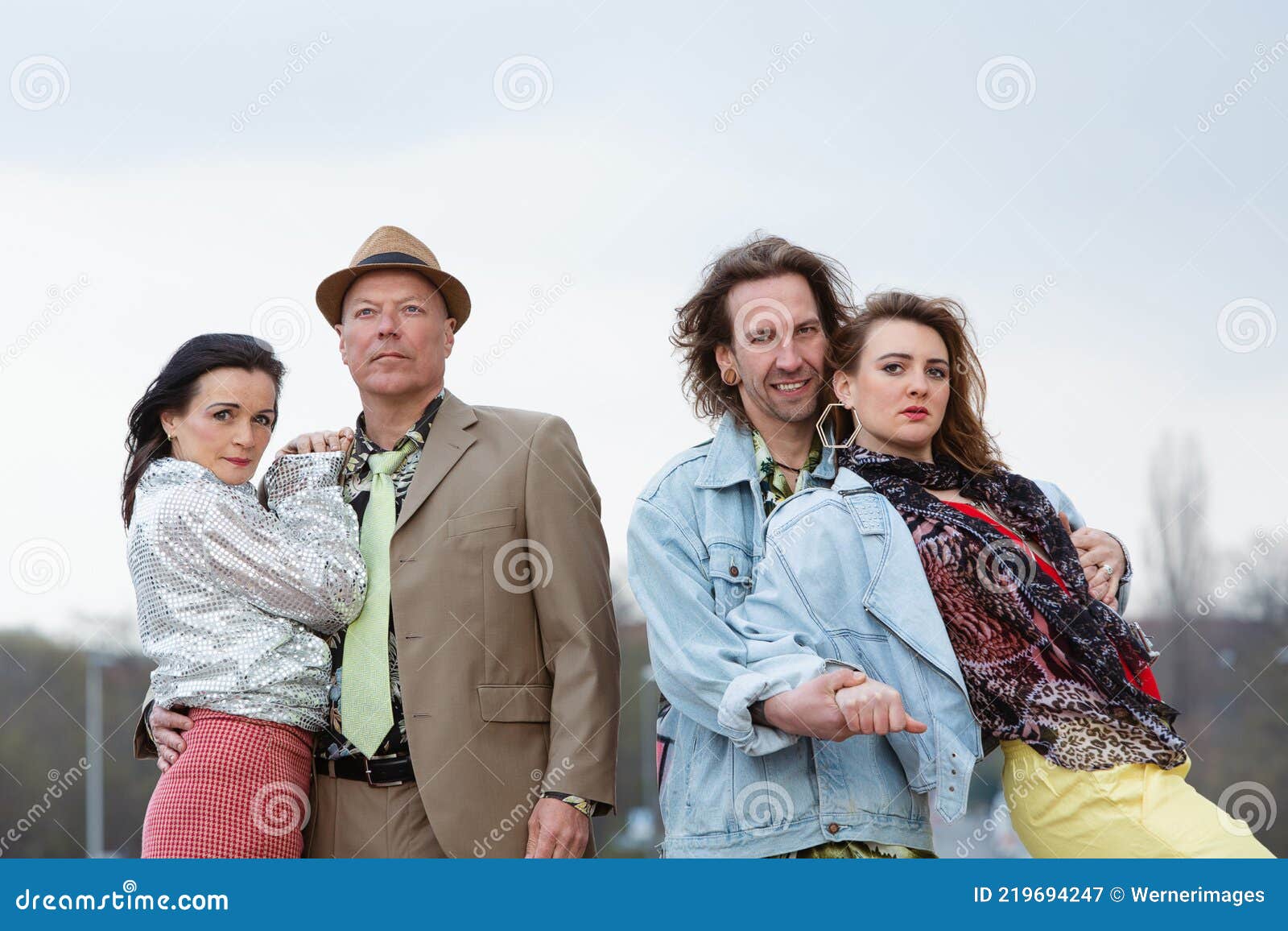 Two Funky Couples In 1980s Style Posing In The Street Royalty-Free