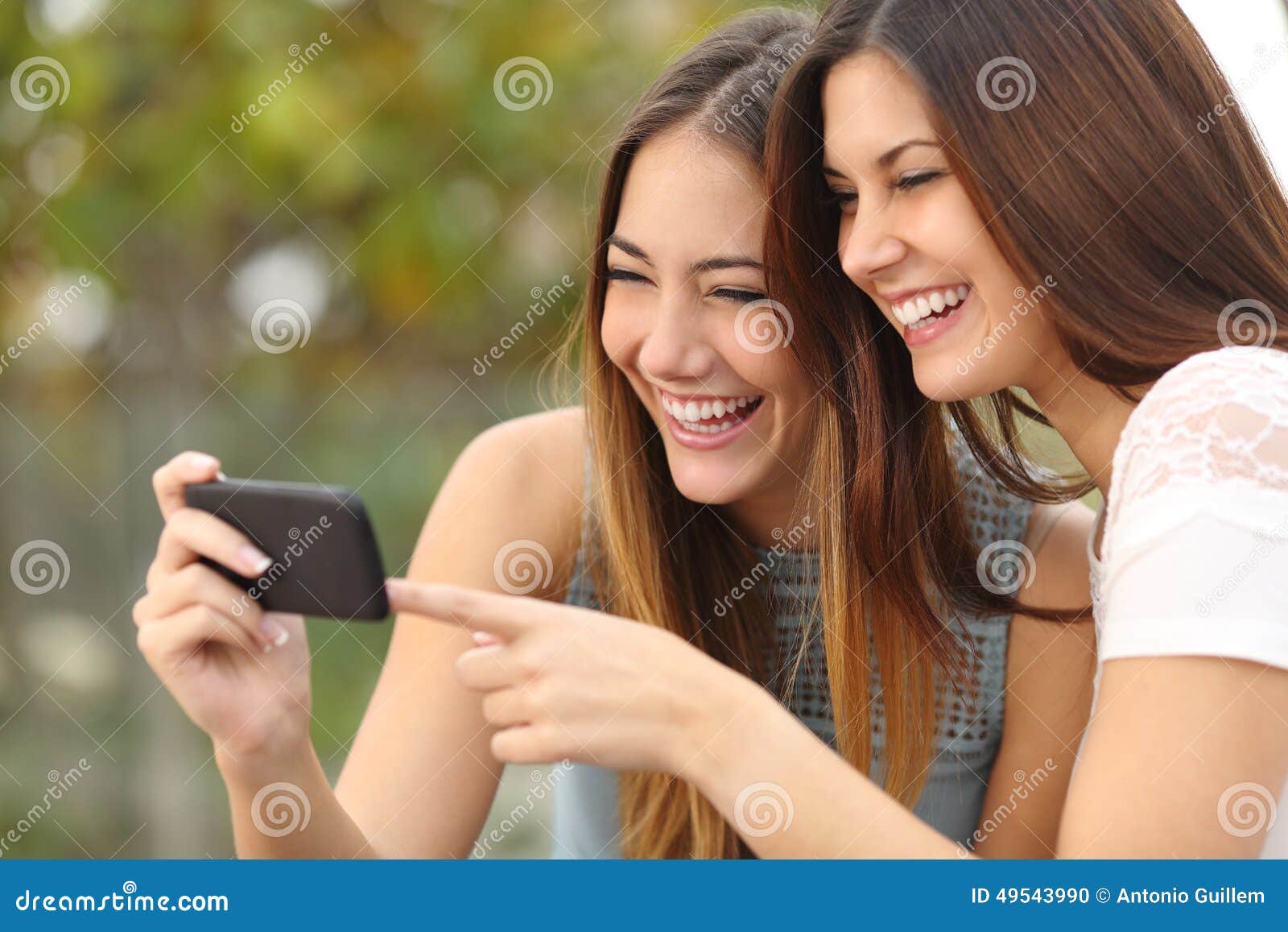 Two Funny Women Friends Laughing and Sharing Media in a Smart Phone Stock Photo - Image of cheerful, application: 49543990 Two Funny Women Friends Laughing and Sharing Media in a Smart Phone Stock Photo - Image of cheerful, application: 49543990