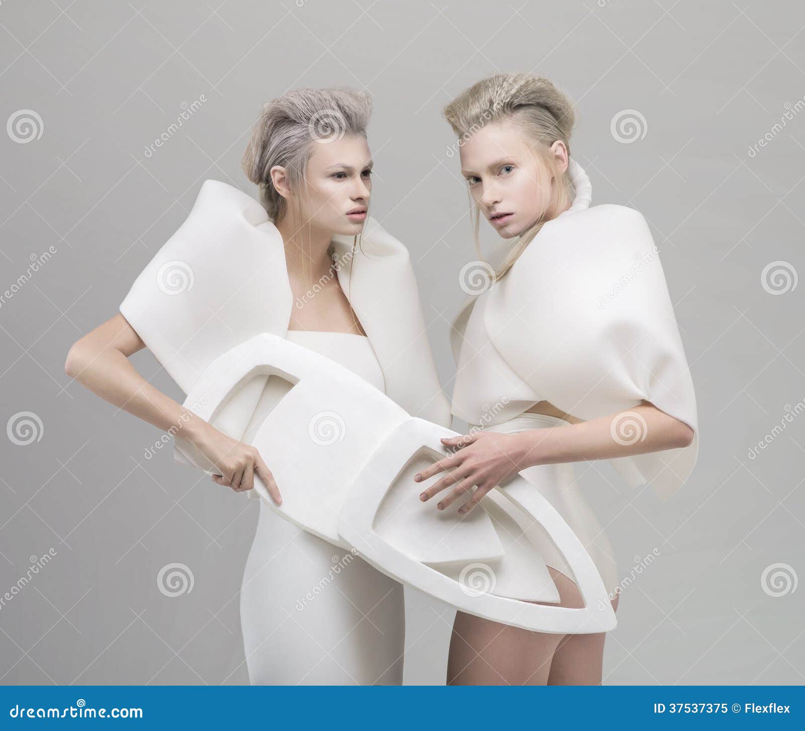 two futuristic blonde women in white outfit