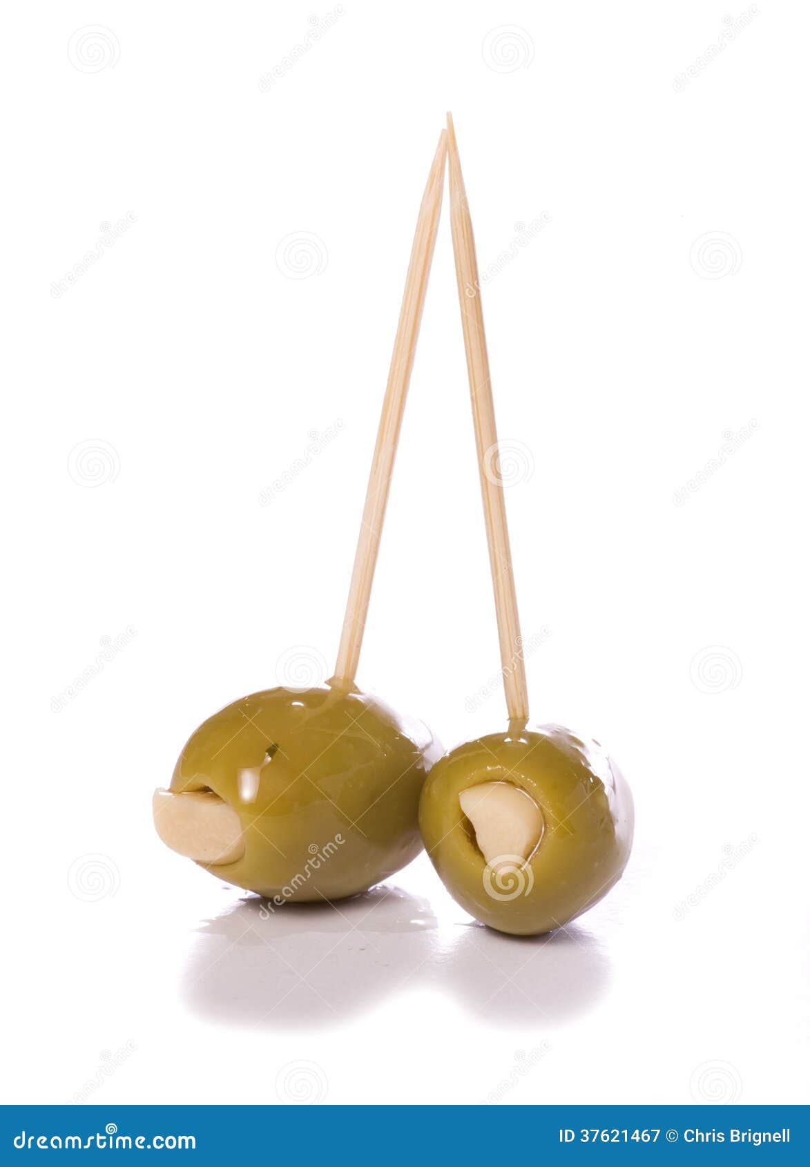 Two Garlic Stuffed Green Olives Stock Image Image of garlic, stick