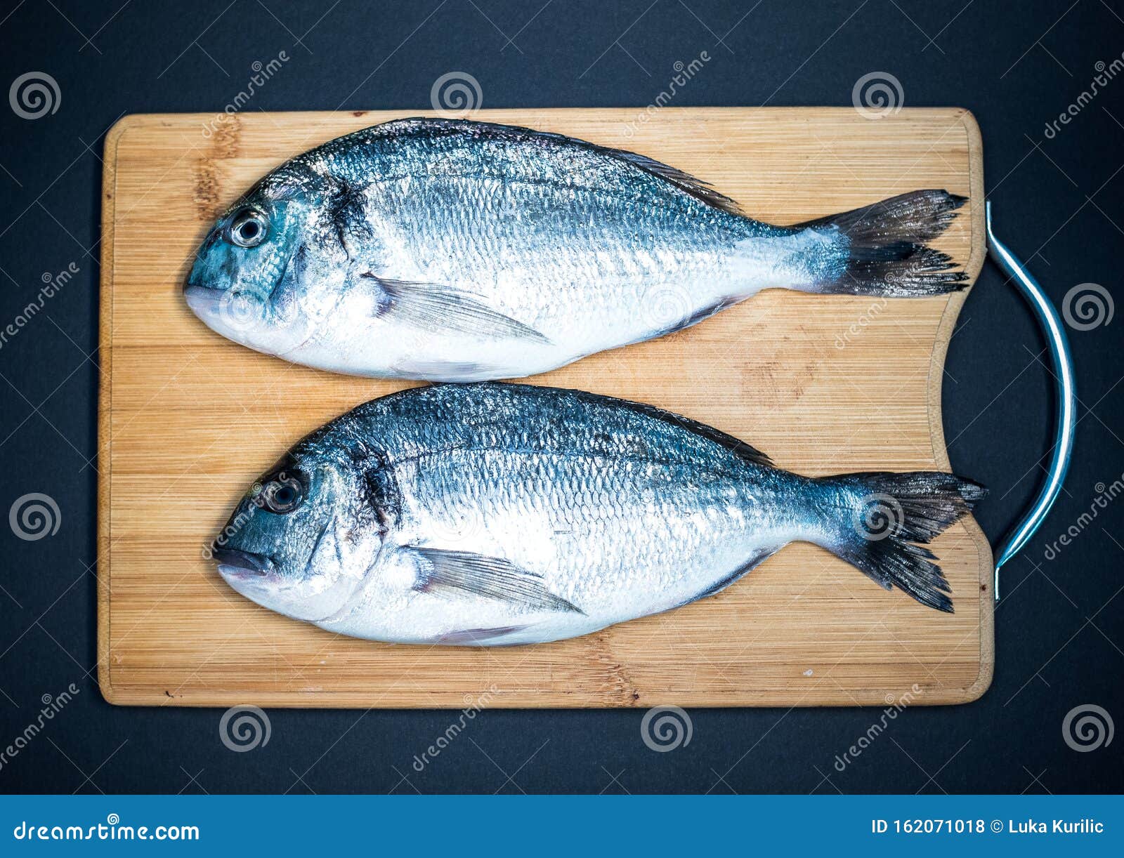 Two Gilthaed Fresh Fish on Wooden Tray Stock Photo - Image of