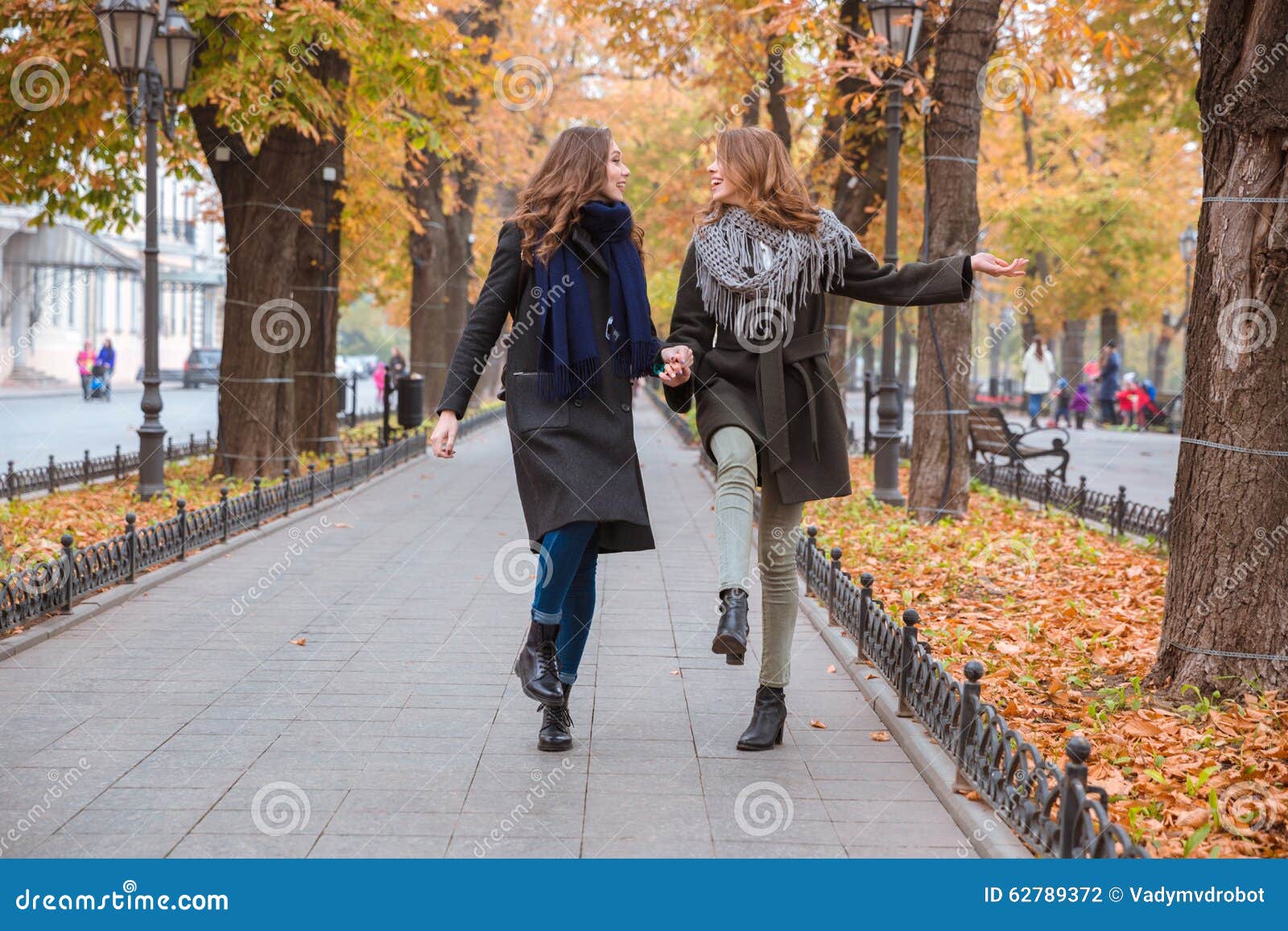 Two Girlfriends Walking in Autumn Park Stock Photo - Image of park ...