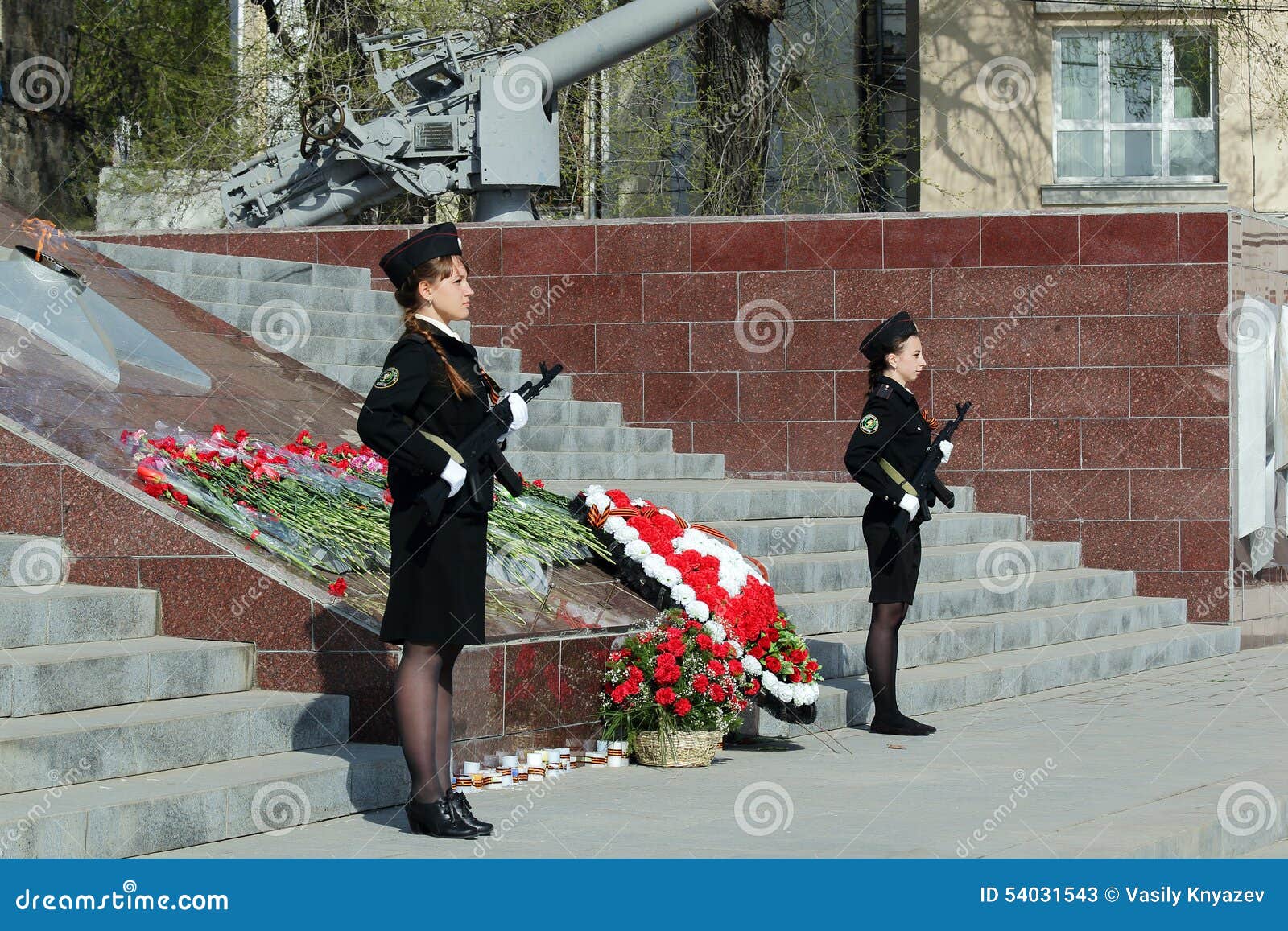 two girls cadets with weapons