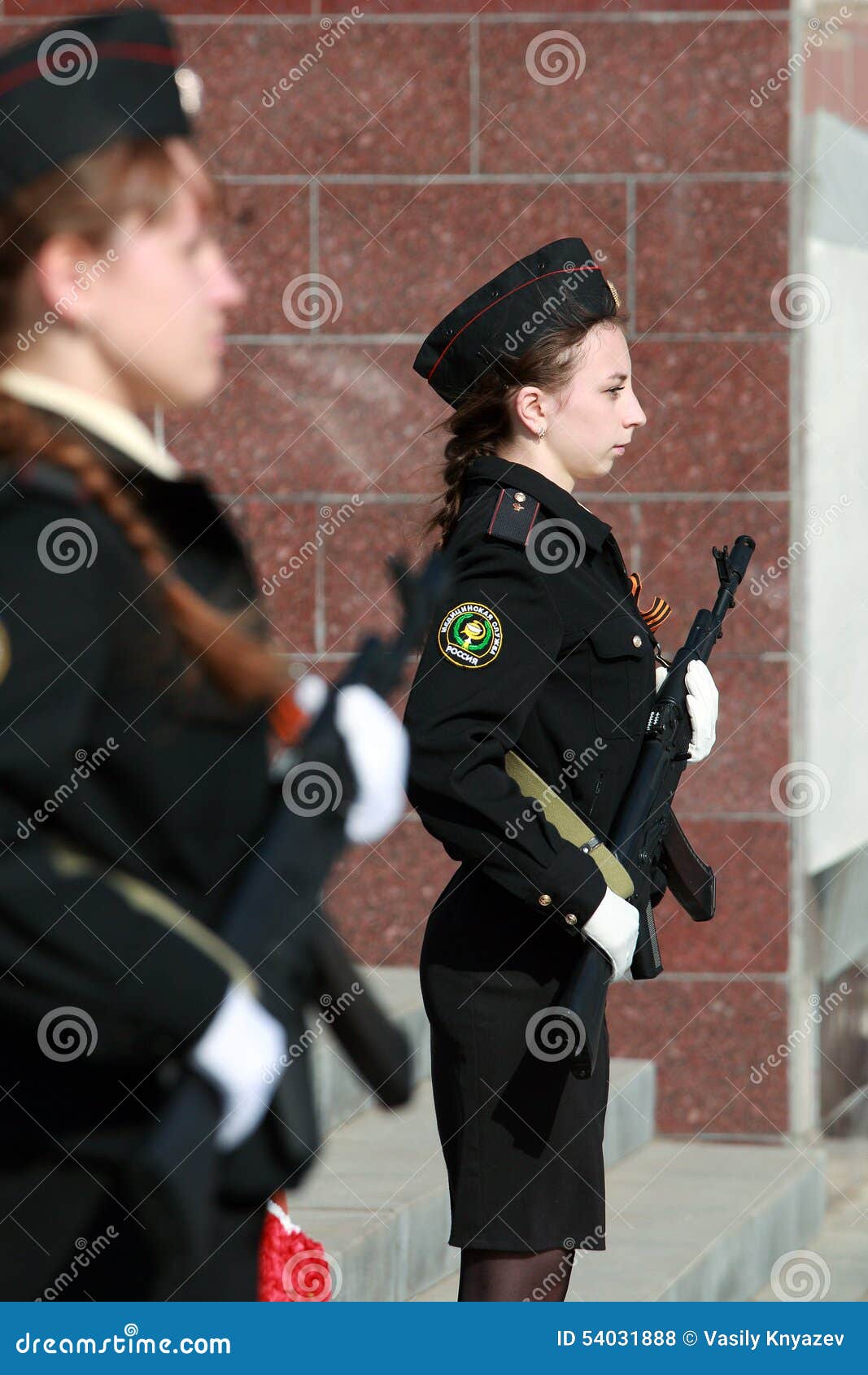 two girls cadets with weapons