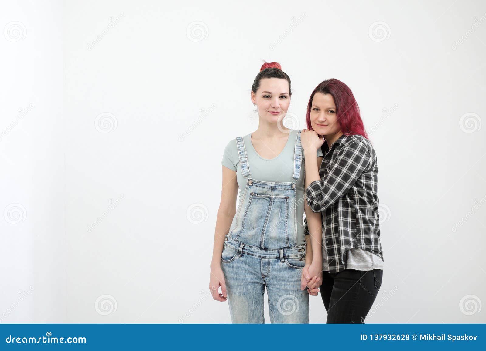 Two Girls Hug On A White Background Homosexual Lesbian