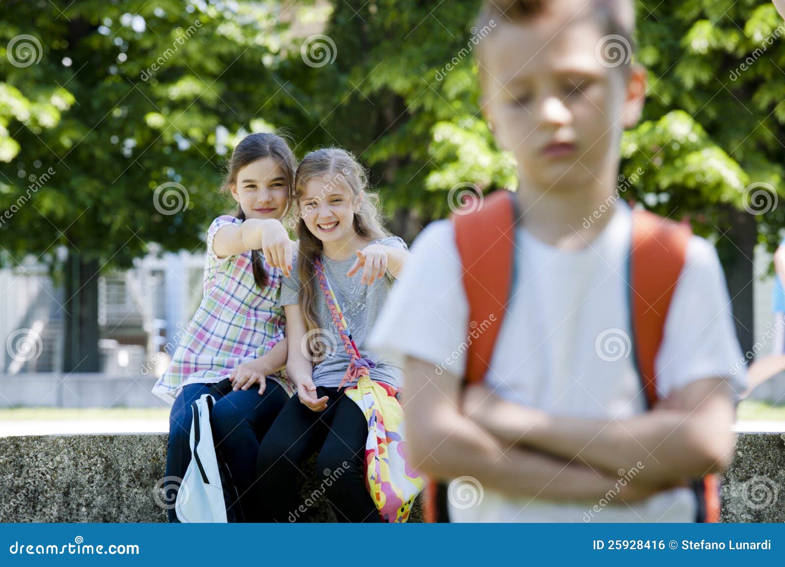 two girls mocking a boy stock photo image of boys little 25928416