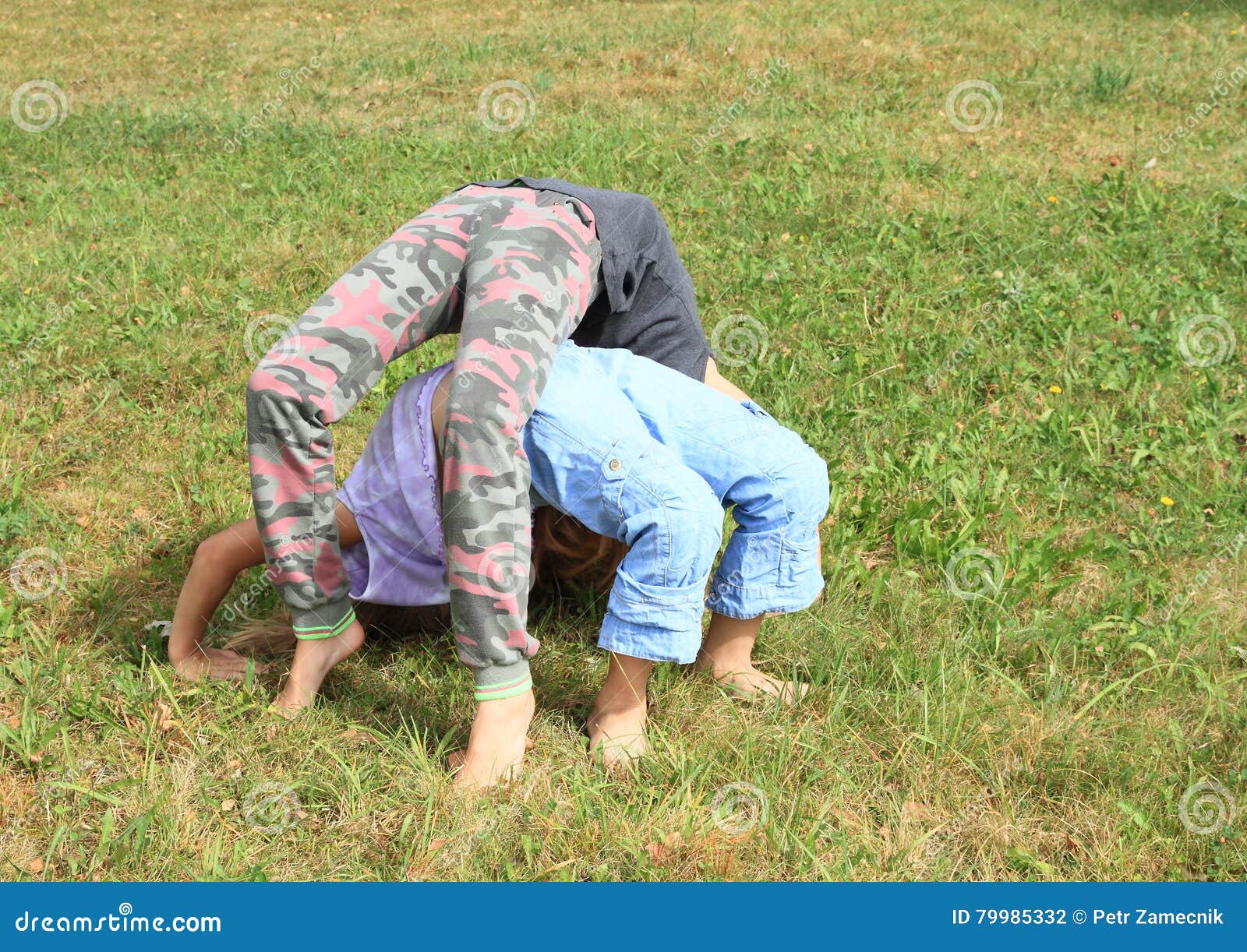 https://thumbs.dreamstime.com/z/two-girls-playing-exercising-yoga-meadow-little-barefoot-kids-upward-bow-wheel-pose-one-above-another-green-grass-79985332.jpg