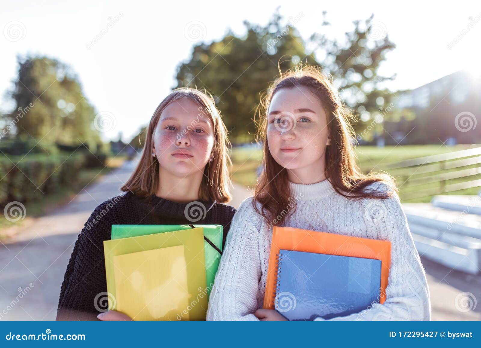 Two Girls Schoolgirl Girlfriends 12 14 Years Old Summer Portrait In City On Street In Hands Of 