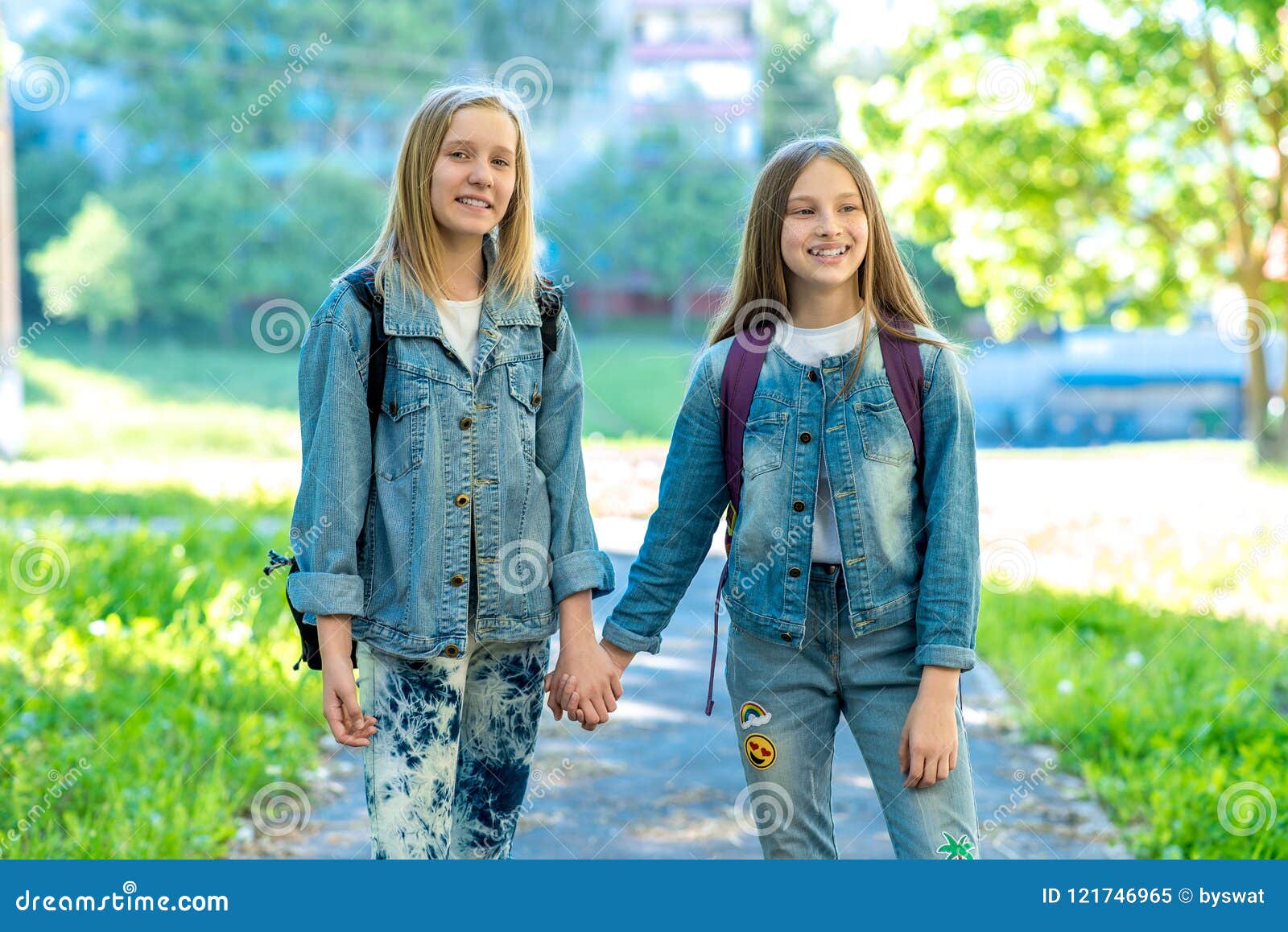 Two Girls Schoolgirl Summer In Nature They Hold Each Other`s Hands The Concept Best Friends 