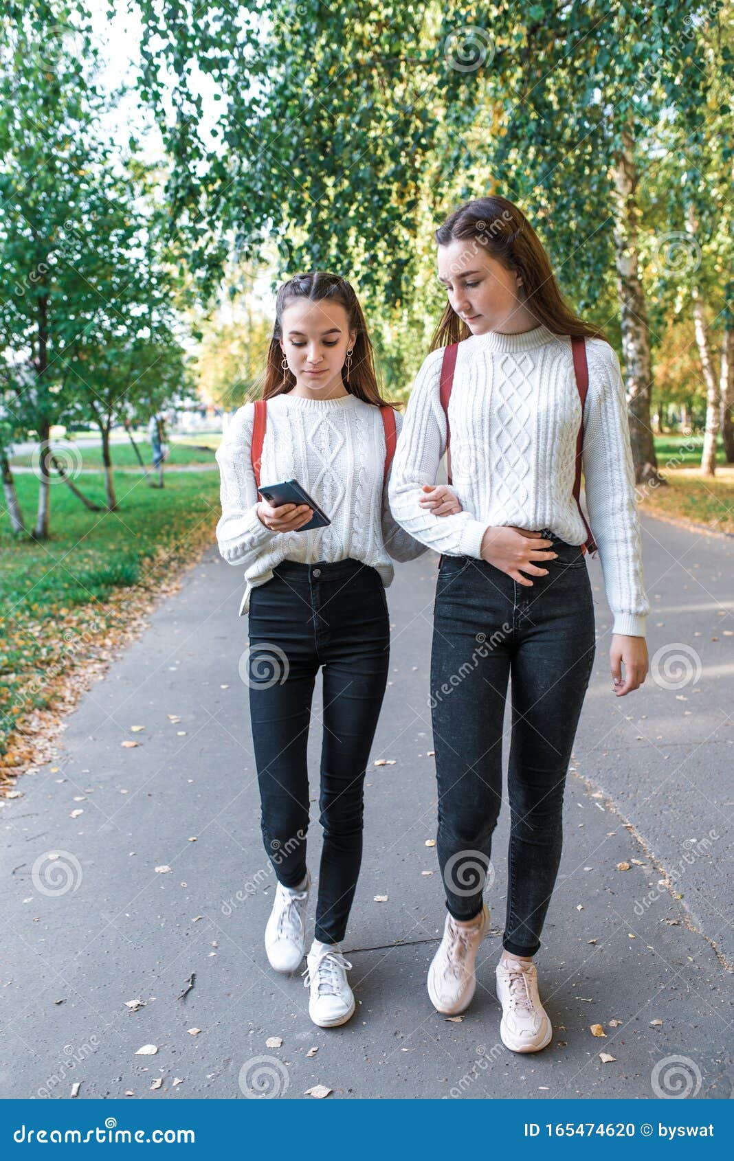 Two Girls Schoolgirl 12 15 Years Old Autumn Summer Day City Return Home On Road Hands Of 