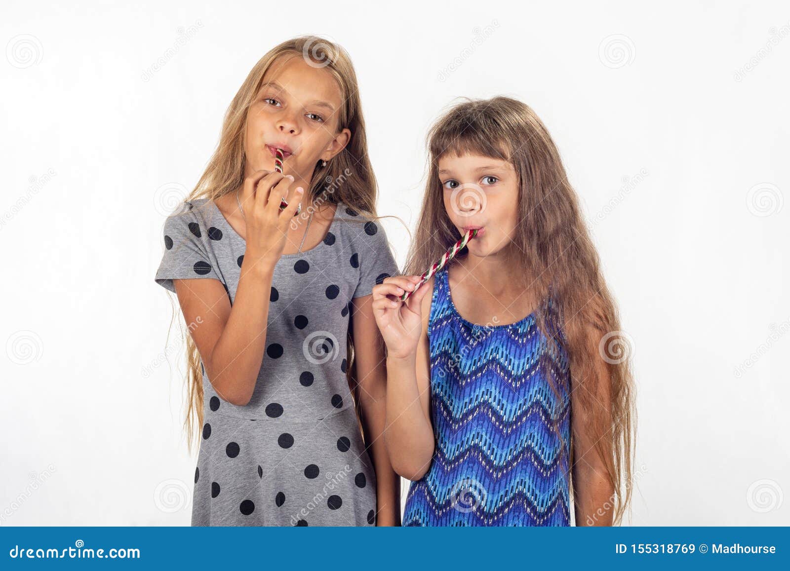 Two Girls Suck Lollipops And Look In The Frame Stock Image Image Of Rejoice Portrait 155318769 