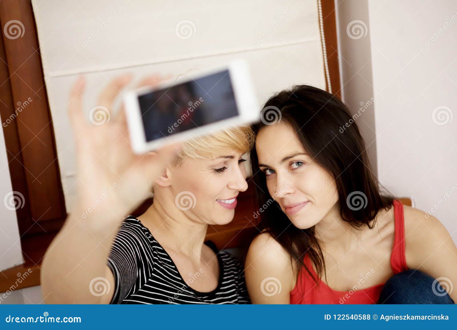 Two girls taking selfie. stock photo. Image of family - 122540588