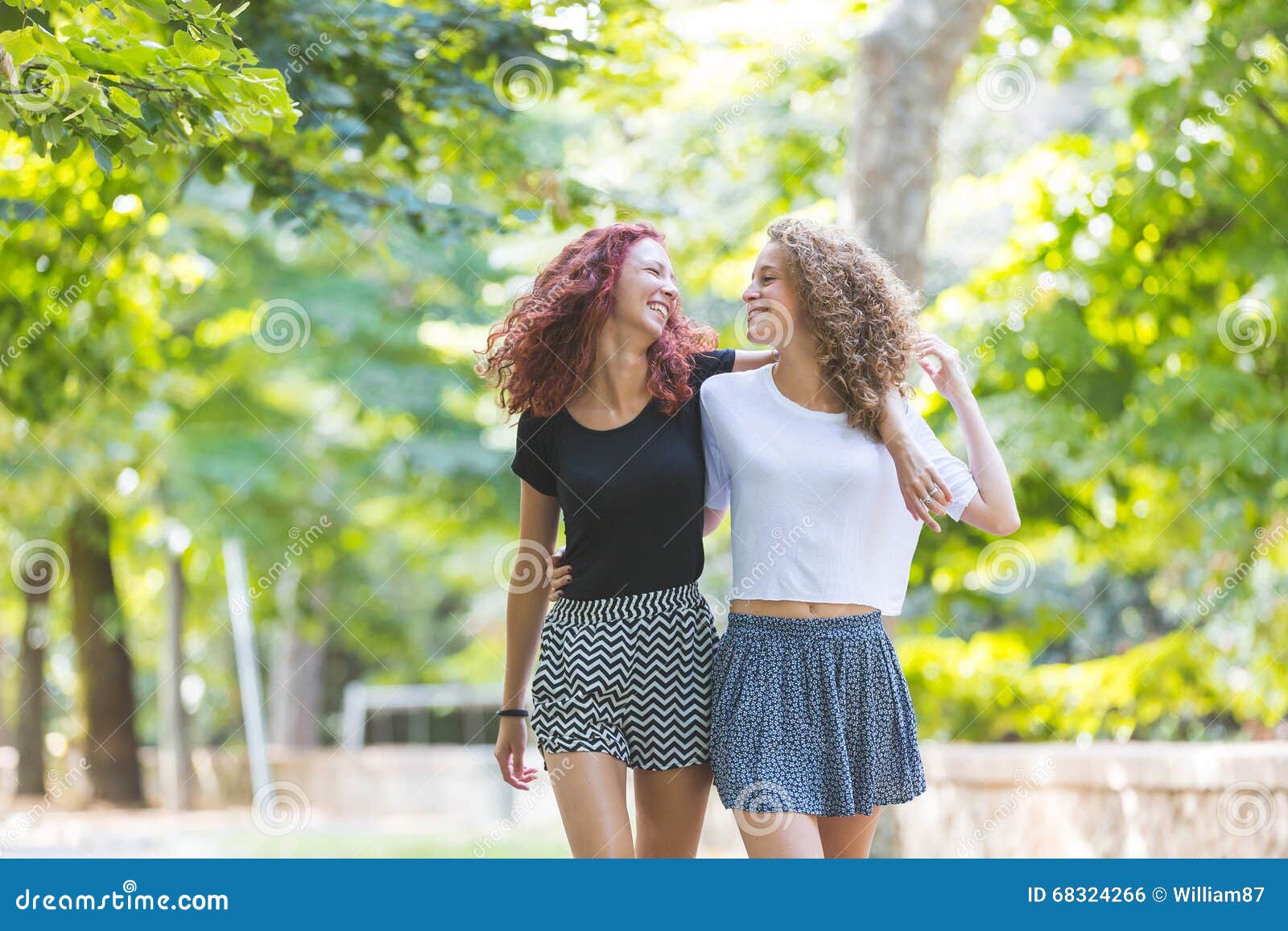 Two Girls Walking Embraced At Park Stock Photo Image Of Friends