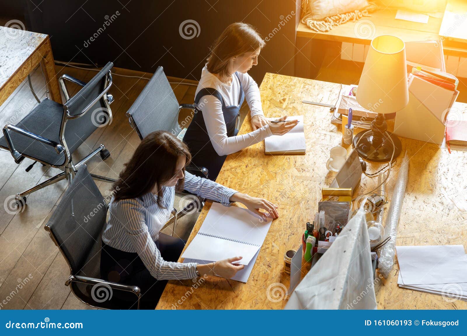 Two Girls Working In The Office At The Table Stock Image Image