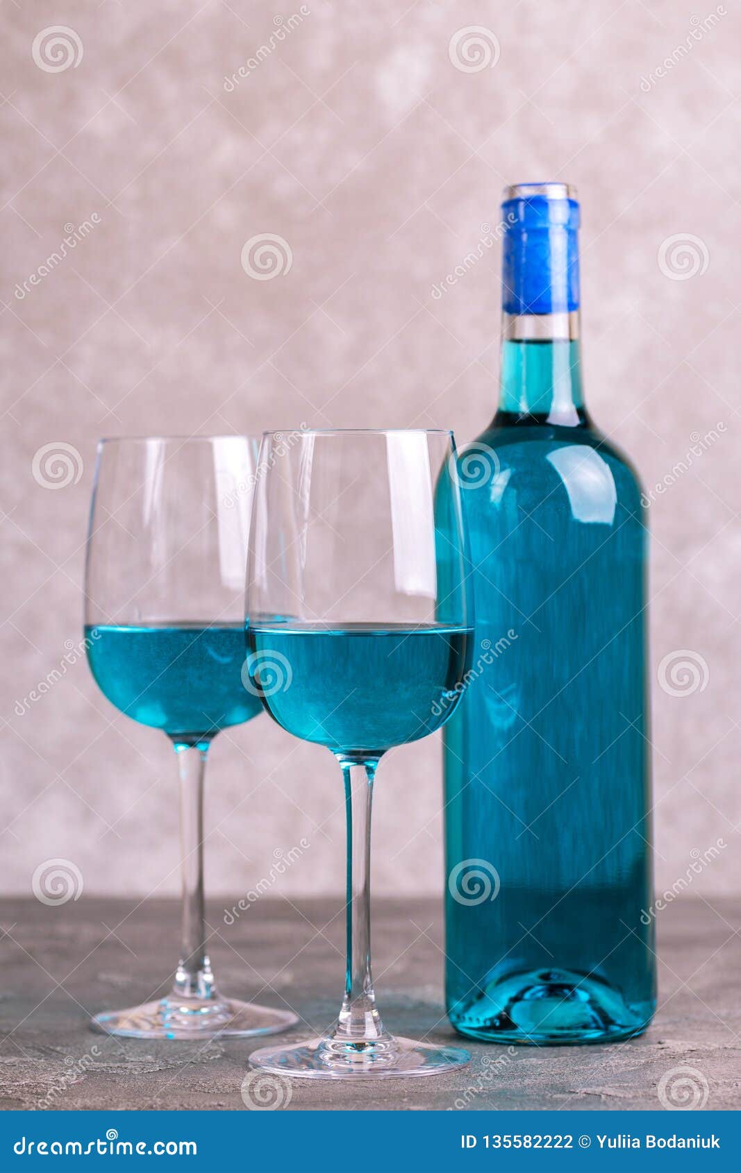 two glasses and bottle of trendy blue wine. spanish chardonnay
