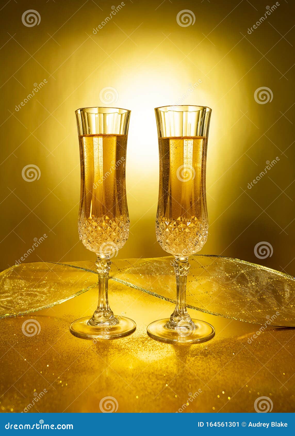 Two Glasses of Champagne on Gold Background. Stock Image Image of