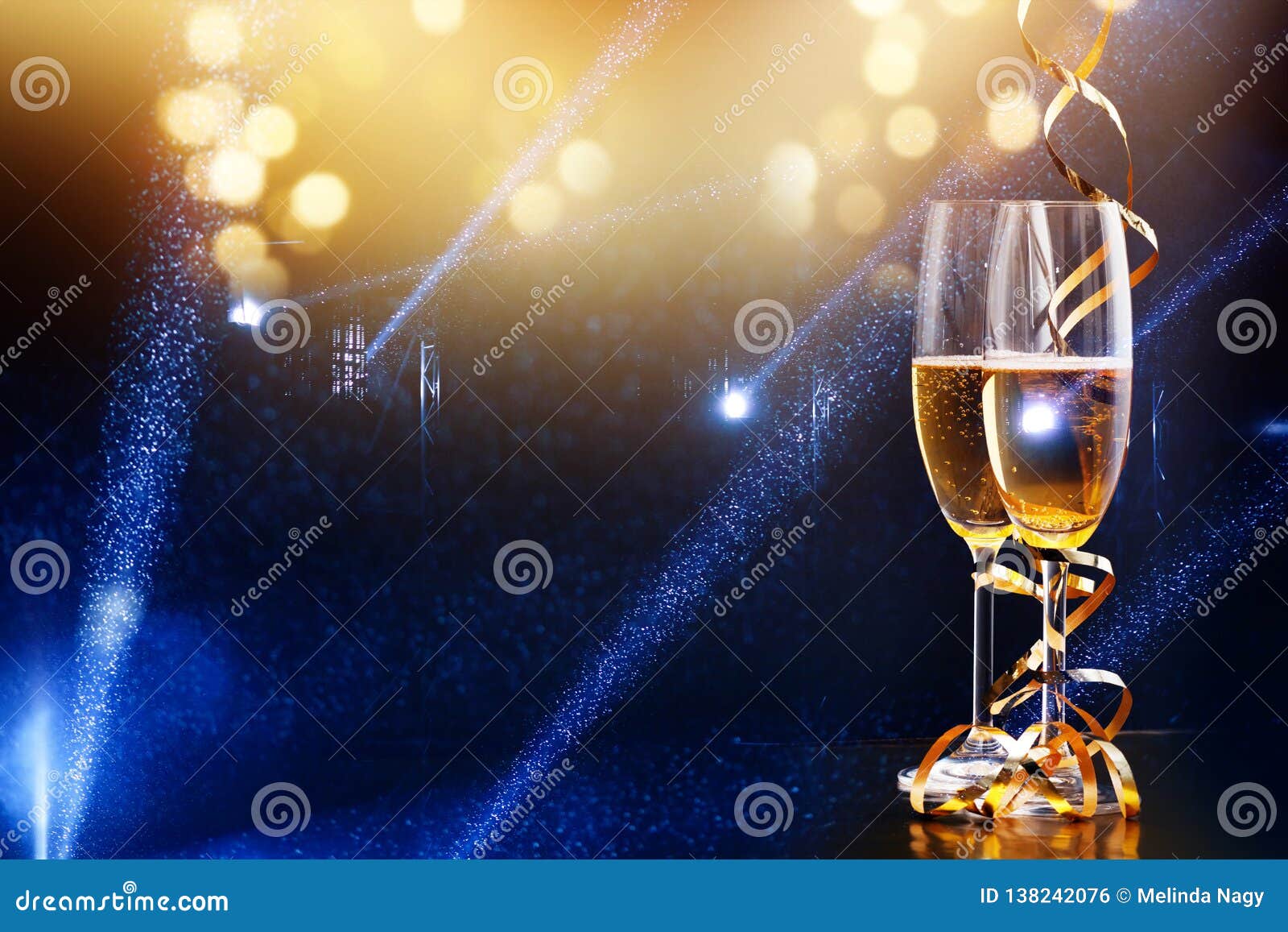Two Glasses of Champagne in the Spotlight New Year Celebration Stock