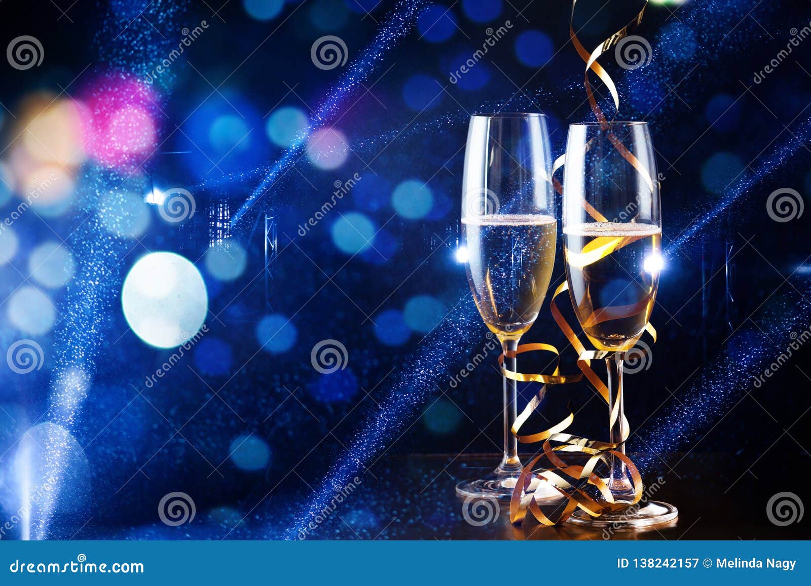 Two Glasses of Champagne in the Spotlight New Year Celebration Stock