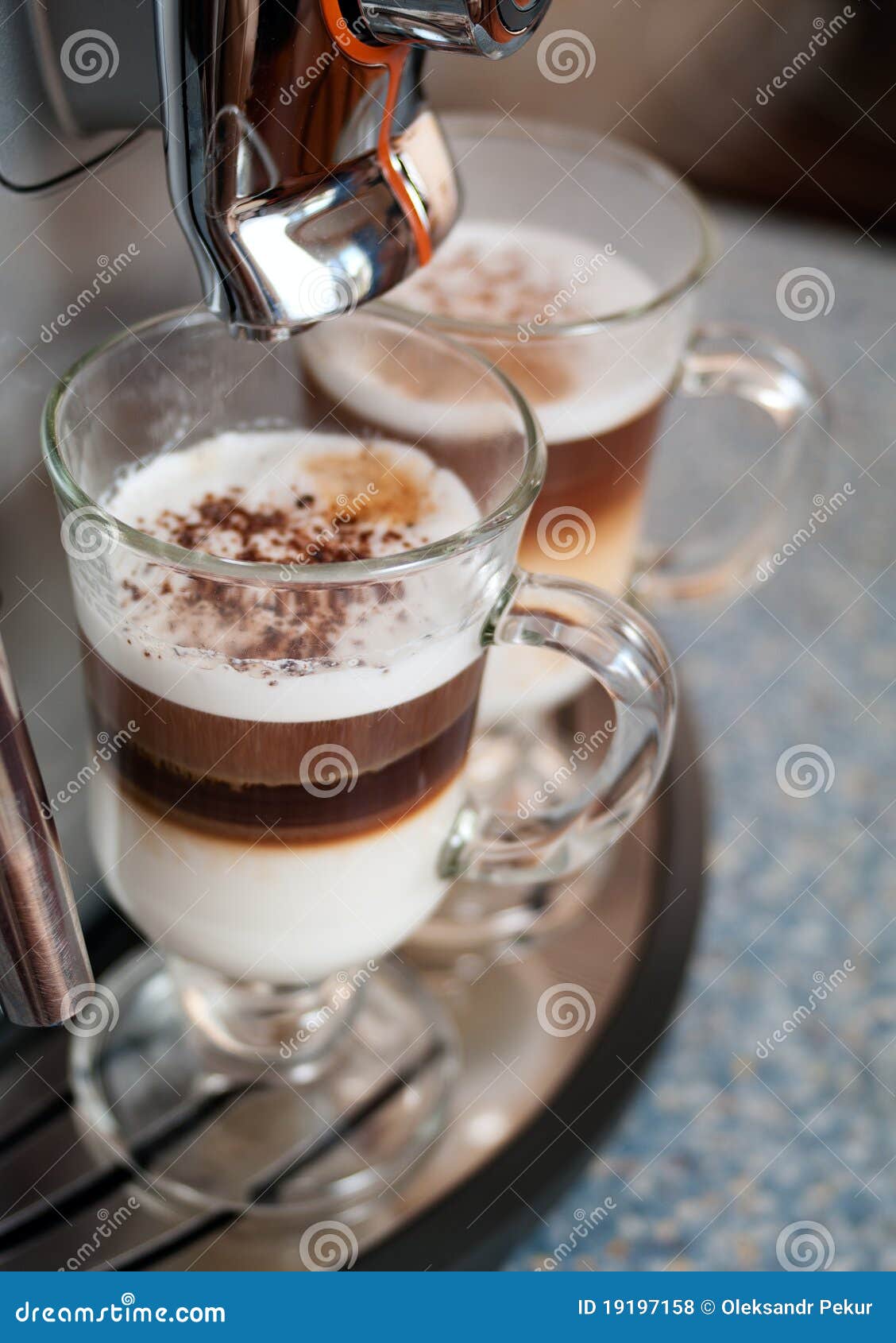 two glasses fileed with capuccino