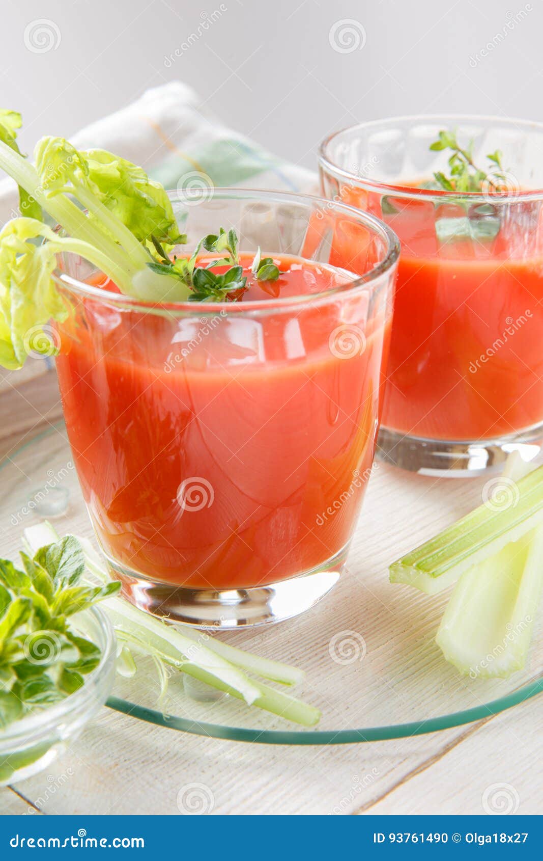 Two Glasses of Fresh Tomato Juice with Thyme and Celery. Stock Photo