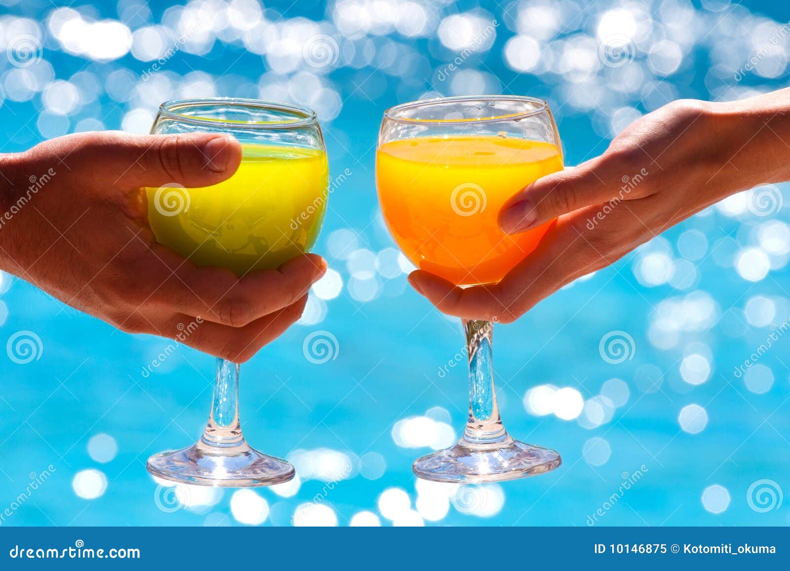 Two Glasses with Juice Against Blue Water Stock Image Image of light