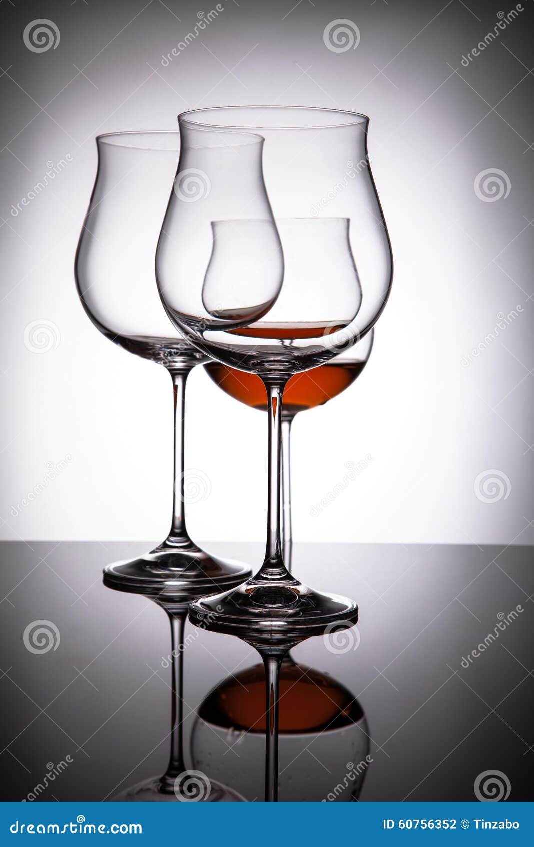 Two Glasses with Red Wine, Creating the Illusion of Four Stock Photo
