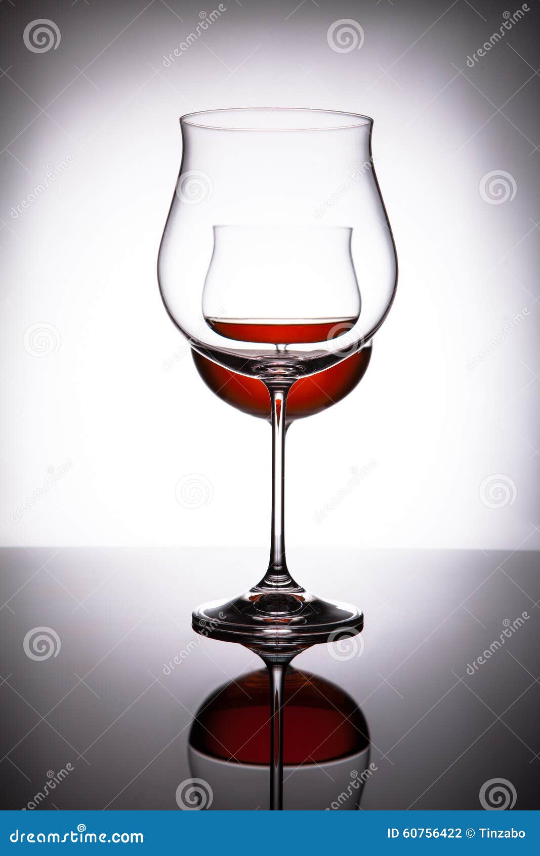 Two Glasses with Red Wine, Creating the Illusion of Three Stock Photo
