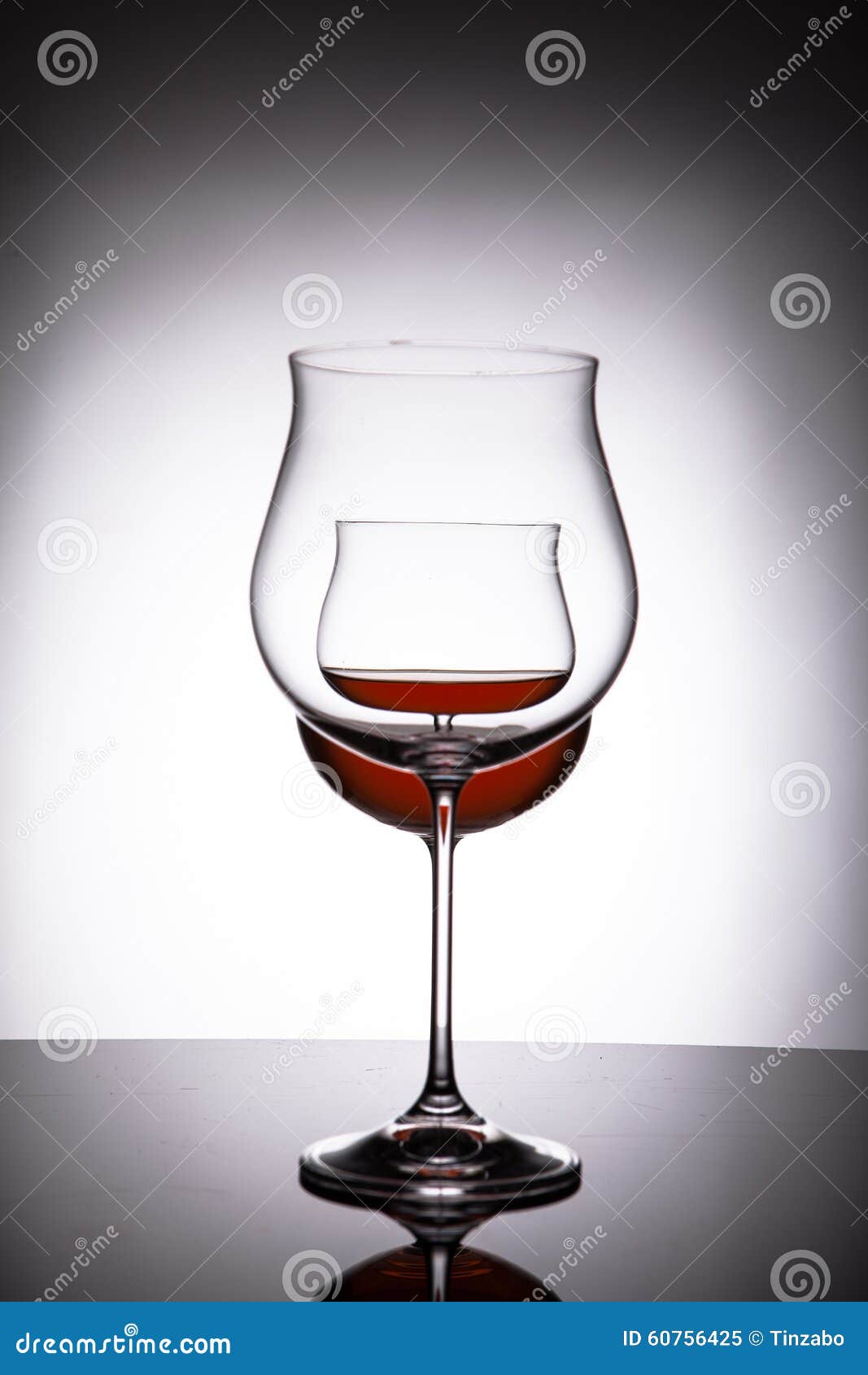 Two Glasses with Red Wine, Creating the Illusion of Three Stock Image