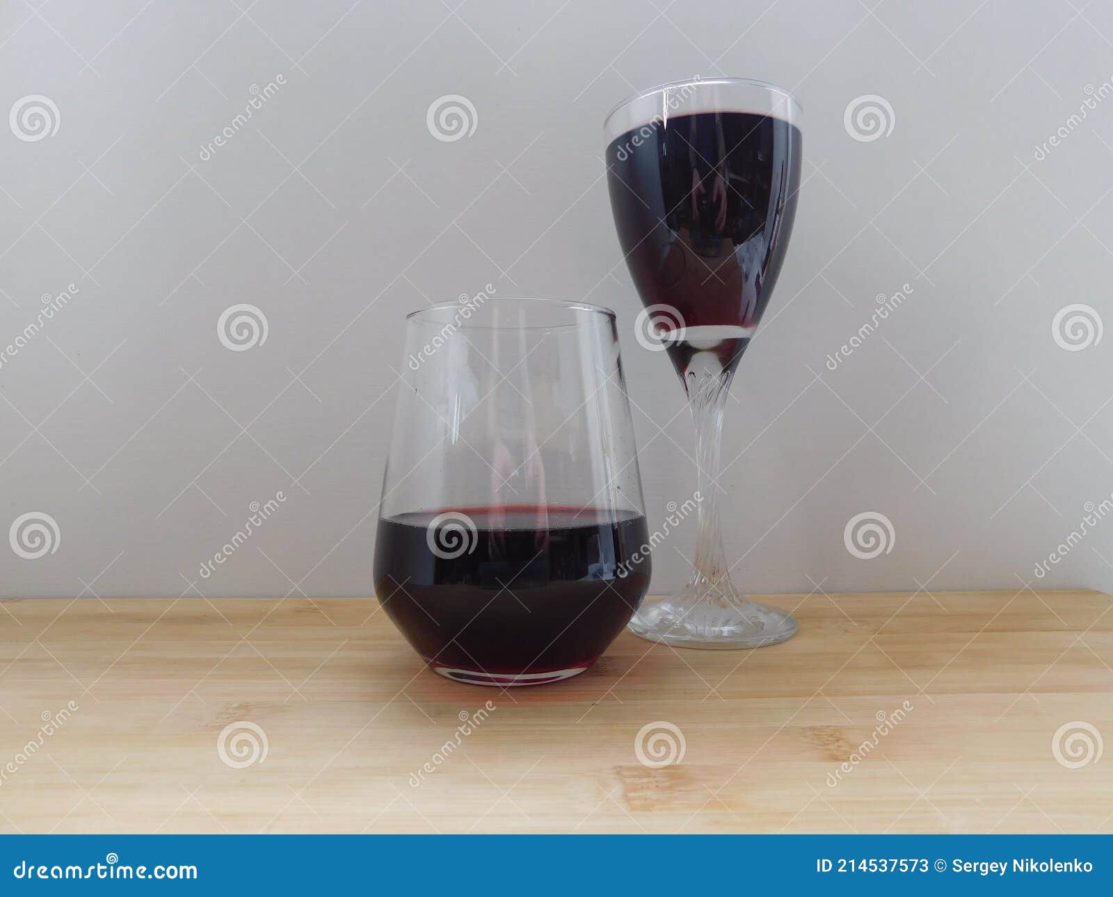 Two Glasses of Red Wine on Kitchen Table Stock Image Image of wood