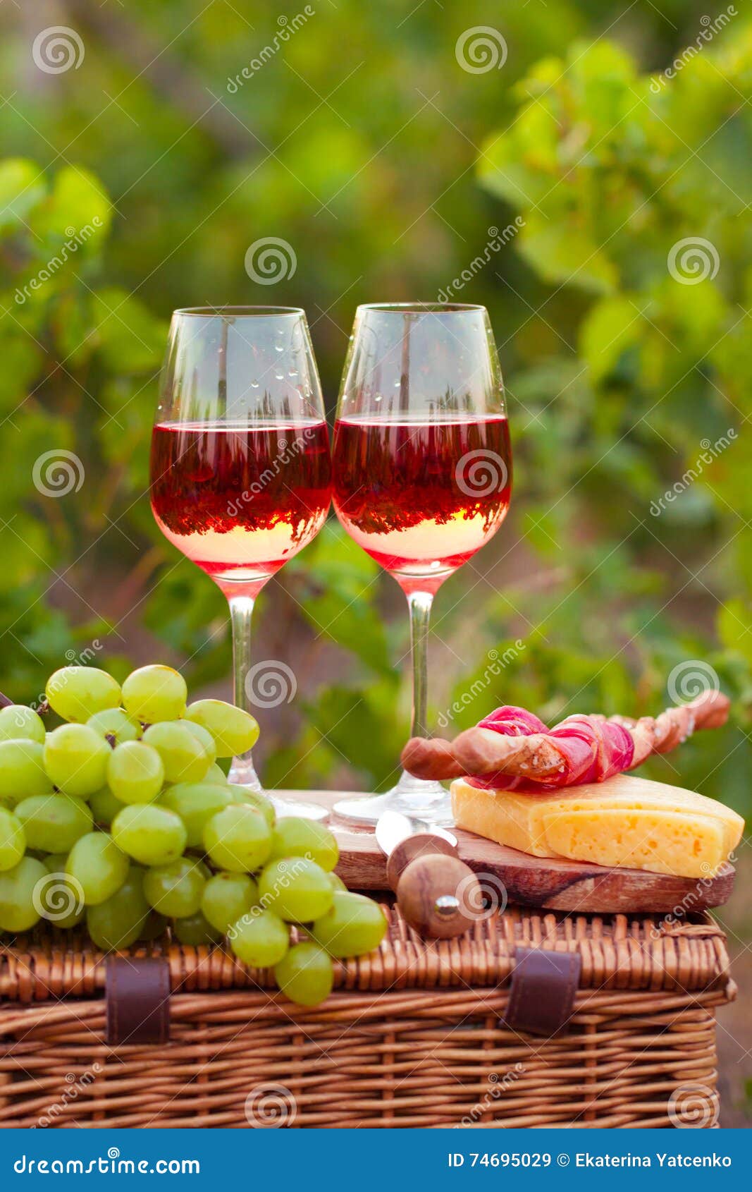 Two Glasses of Rose Wine with Meat, Grape, Bread and Cheese on T Stock
