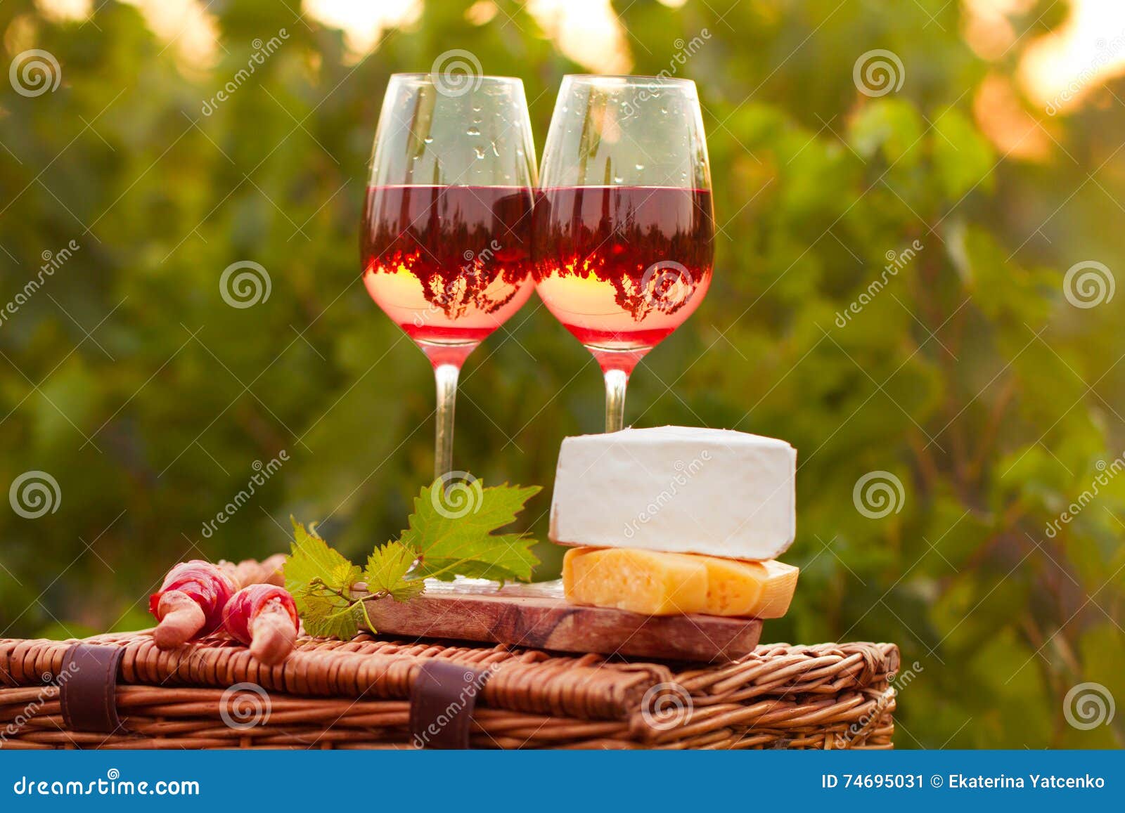 Two Glasses of Rose Wine with Meat, Grape, Bread and Cheese on T Stock